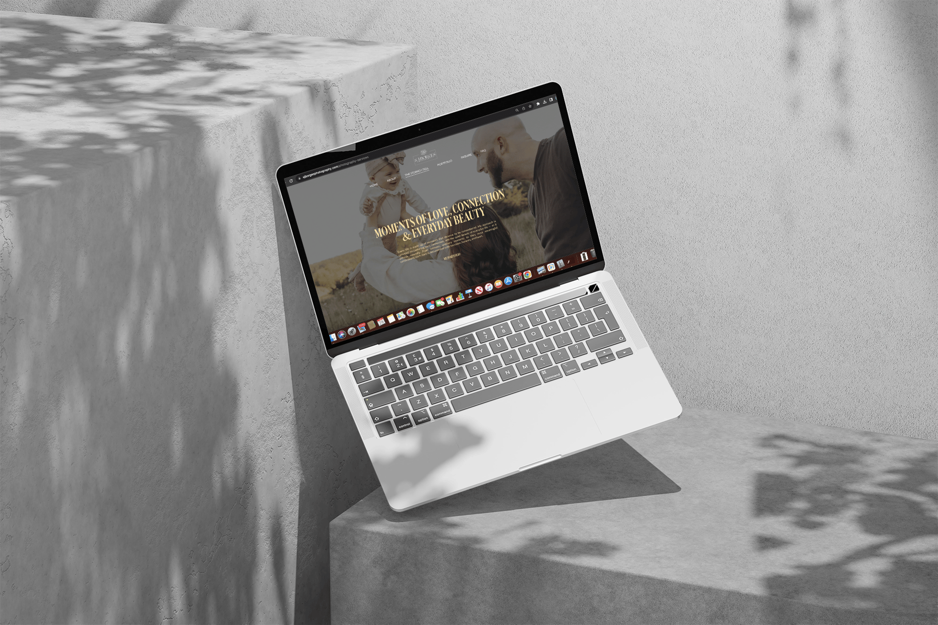 silver macbook on white table