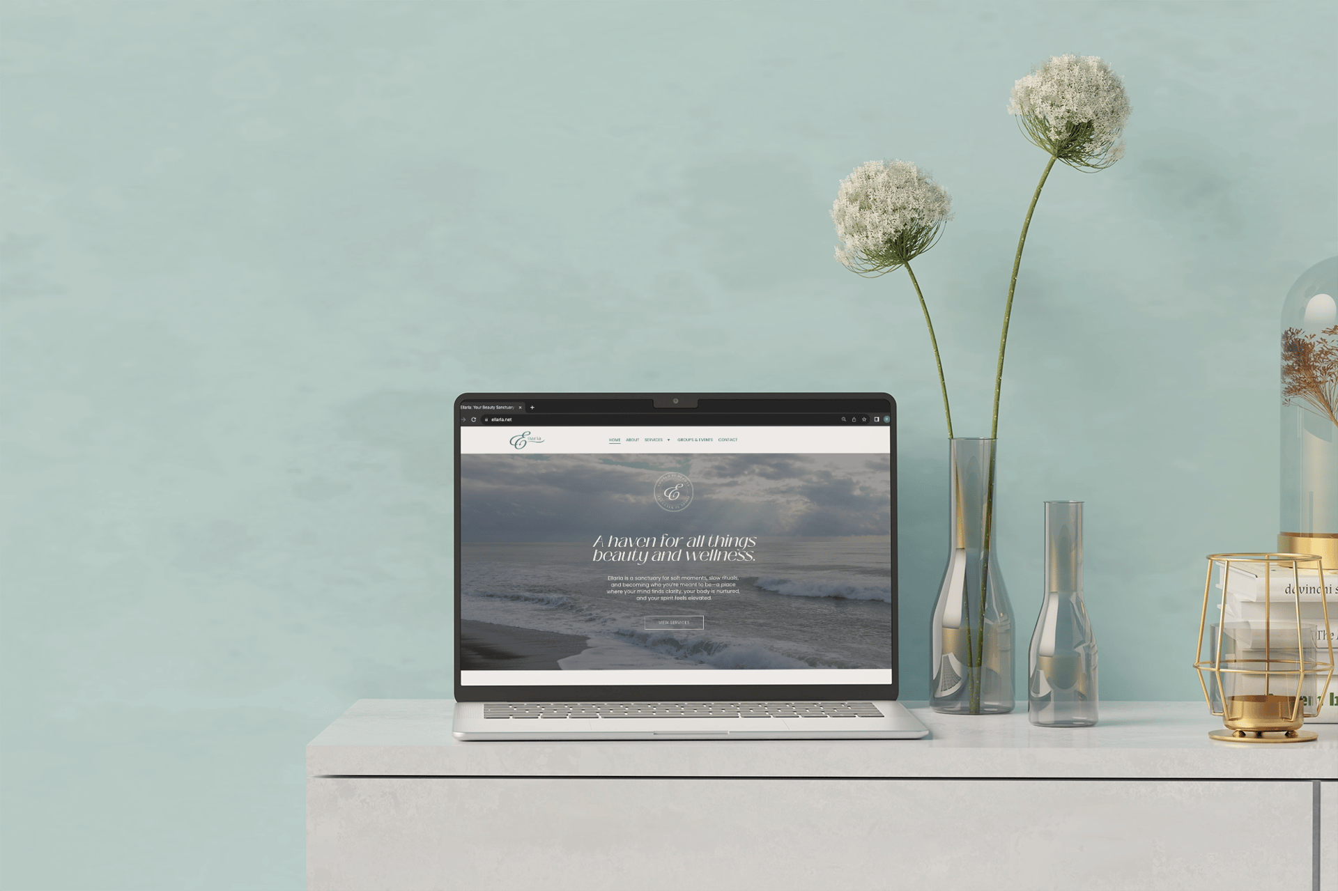 silver macbook on white table