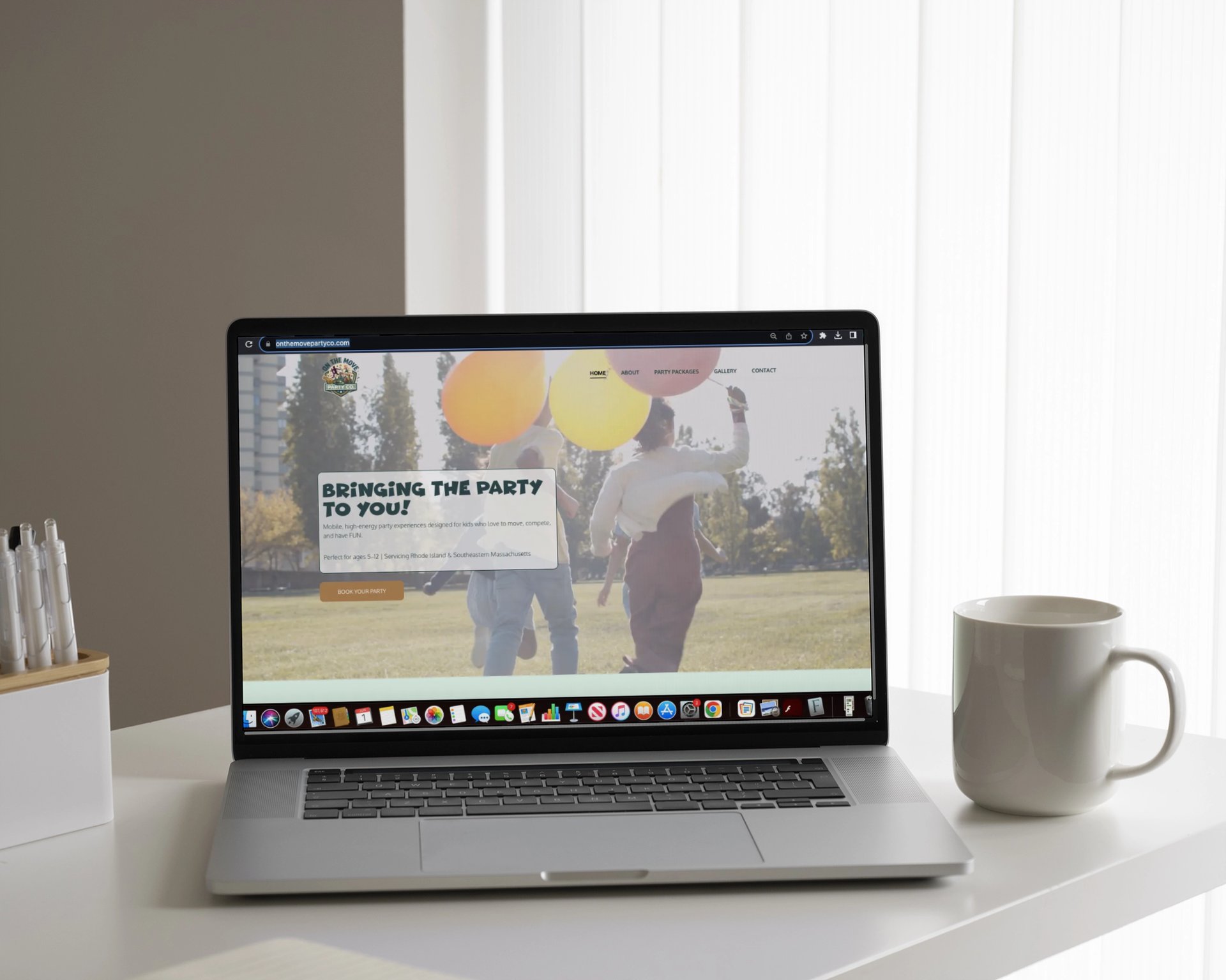 silver macbook on white table
