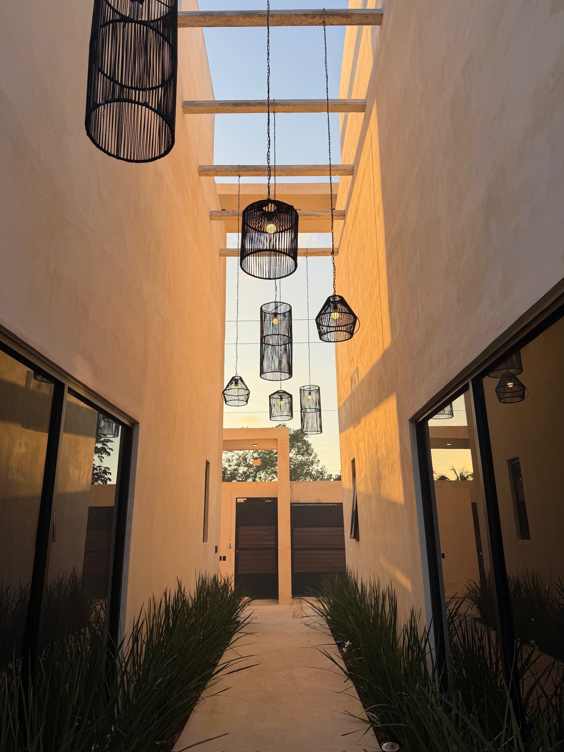 an abstract photo of a curved building with a blue sky in the background