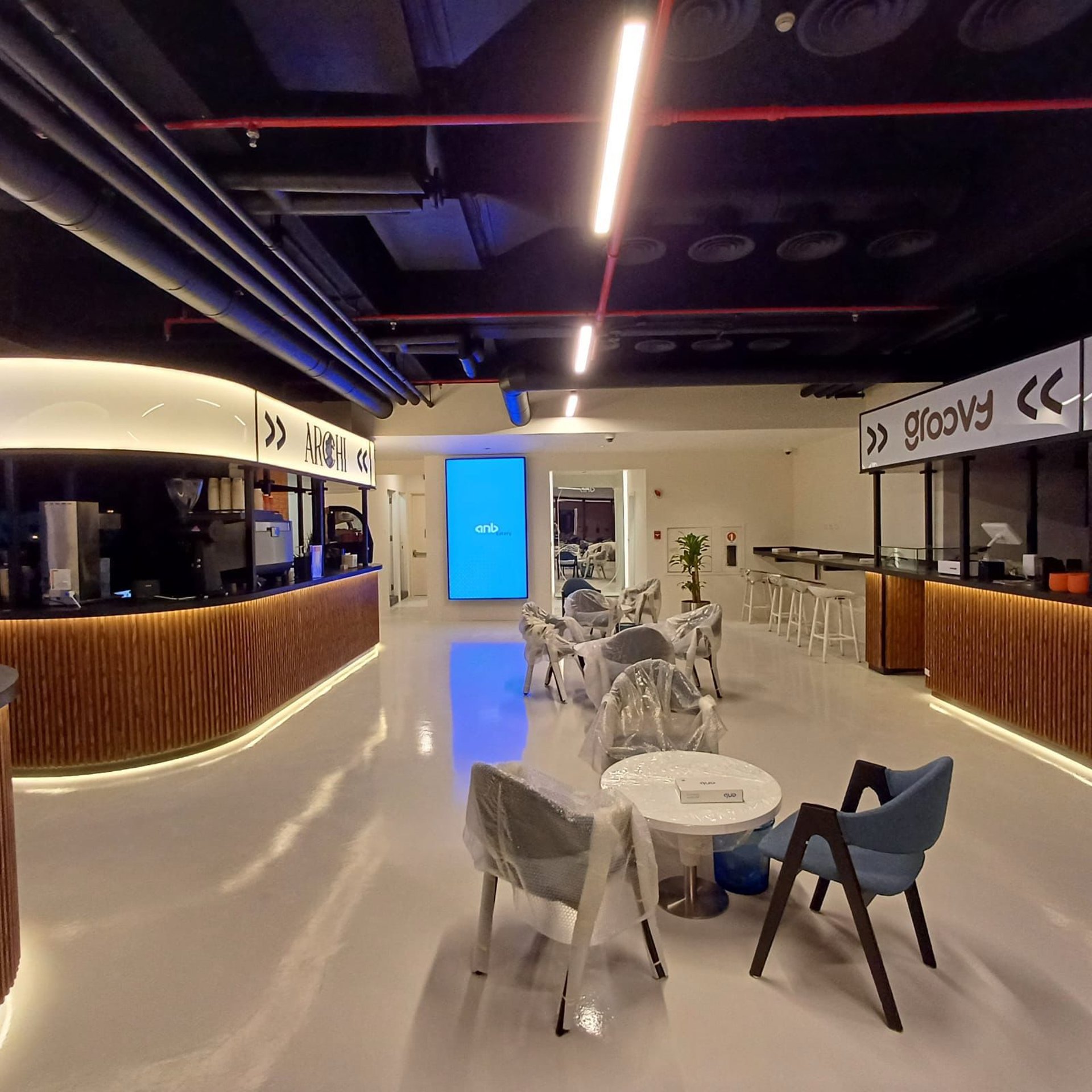 an abstract photo of a curved building with a blue sky in the background