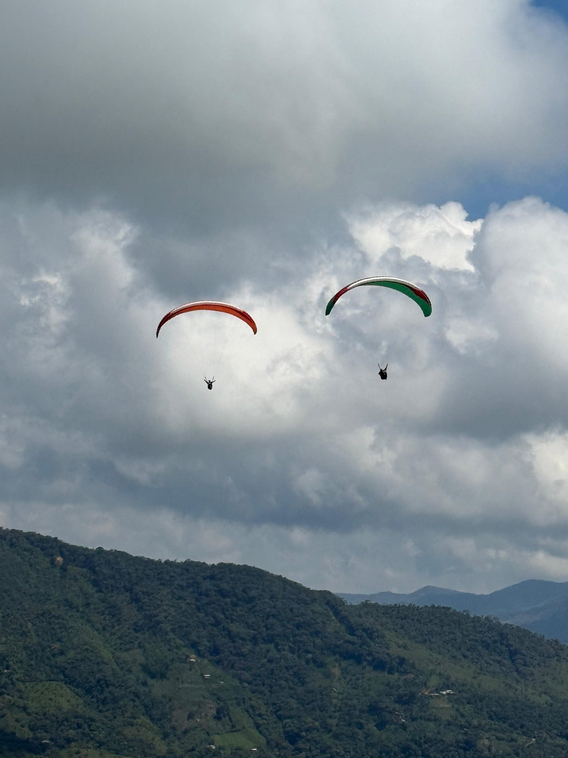 woman wearing yellow long-sleeved dress under white clouds and blue sky during daytime