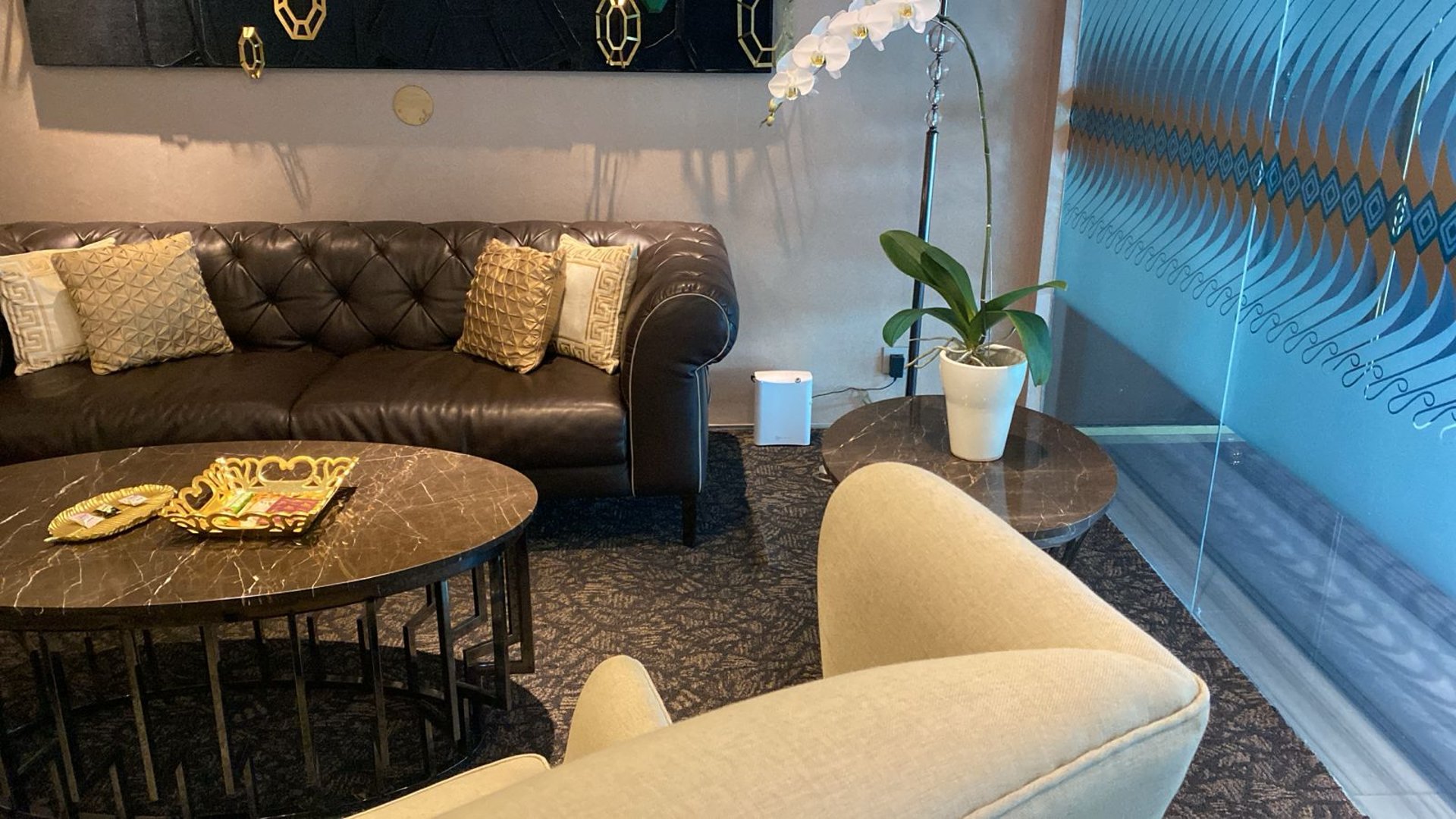 black and brown leather padded tub sofa