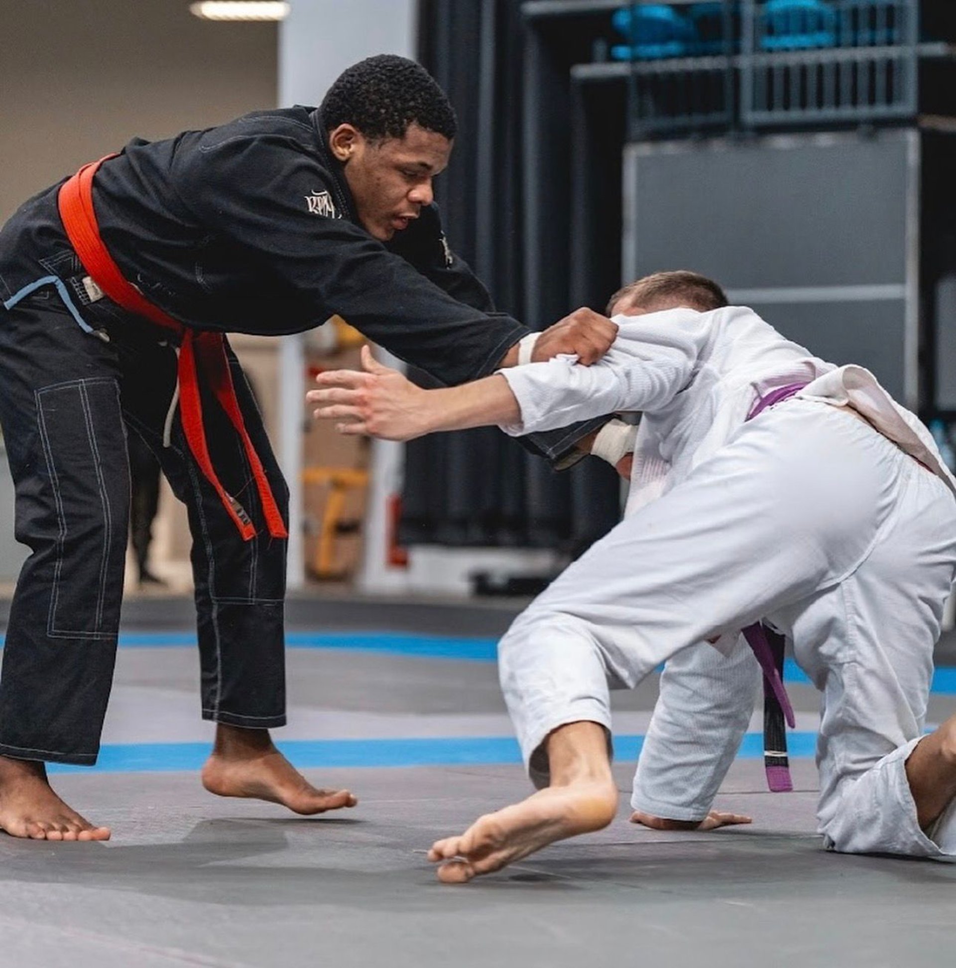 an abstract photo of a curved building with a blue sky in the background