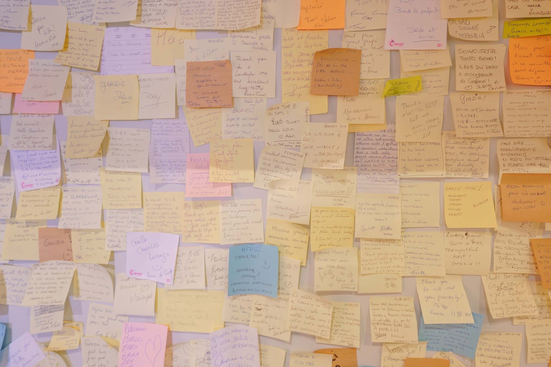 woman wearing yellow long-sleeved dress under white clouds and blue sky during daytime