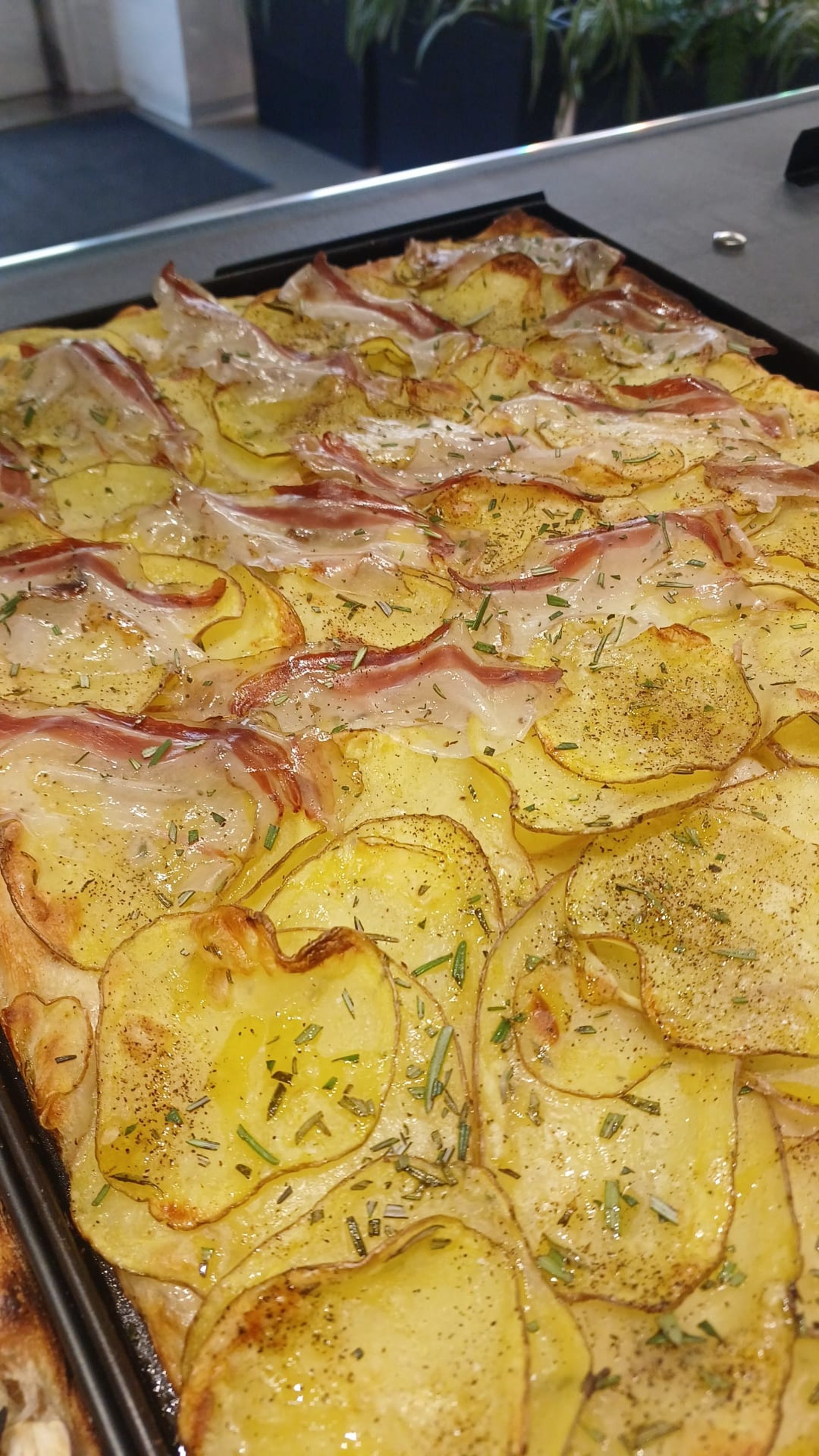 an abstract photo of a curved building with a blue sky in the background