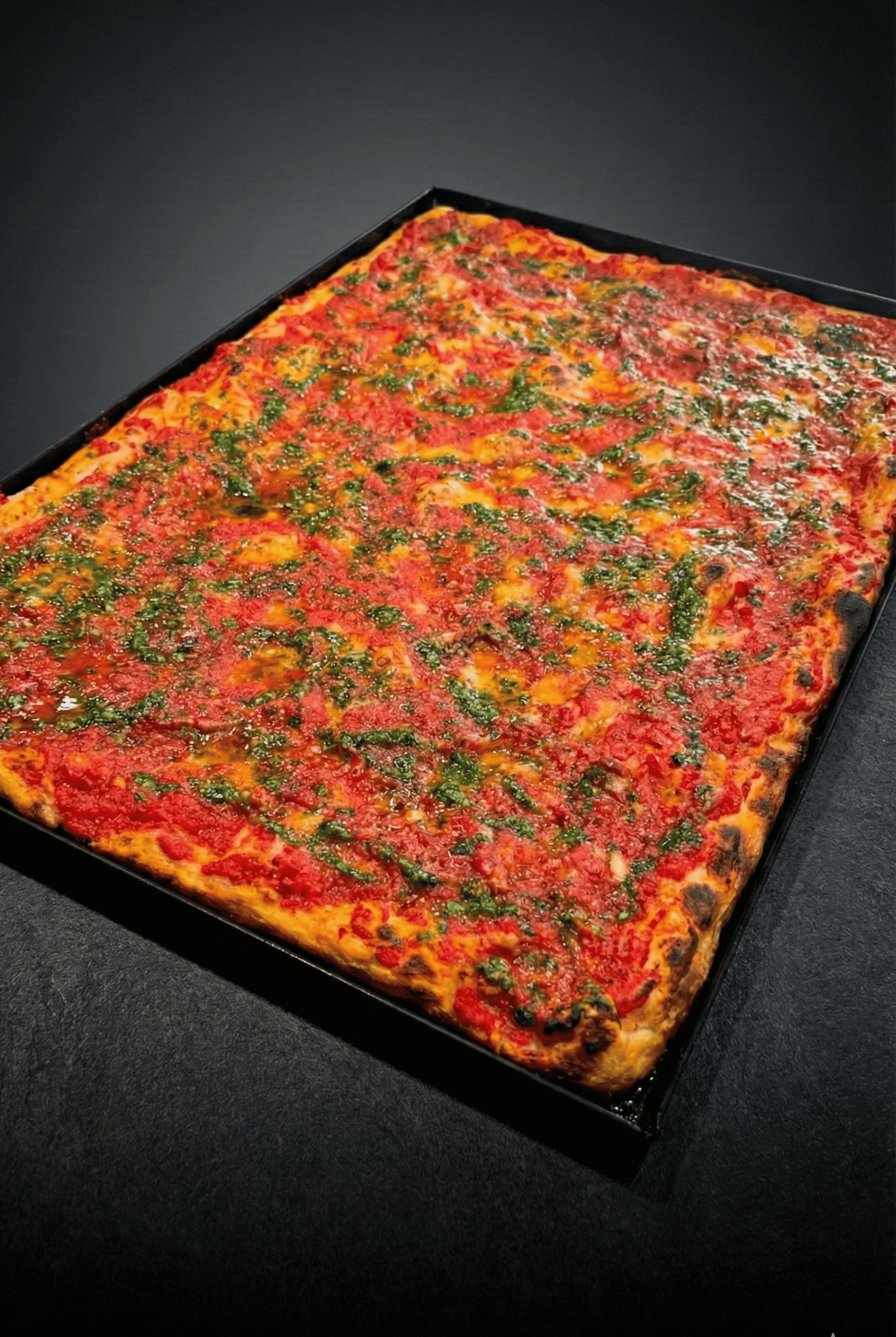 an abstract photo of a curved building with a blue sky in the background