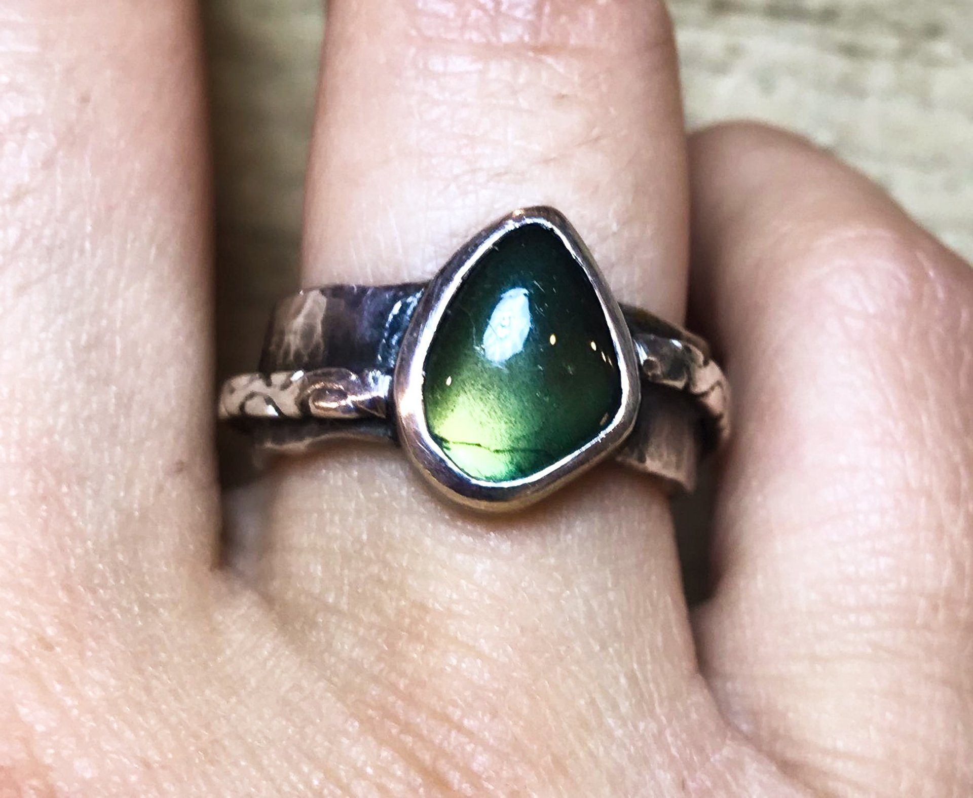 black retractable pen on opened book beside red and white go get'em-printed coffee cup