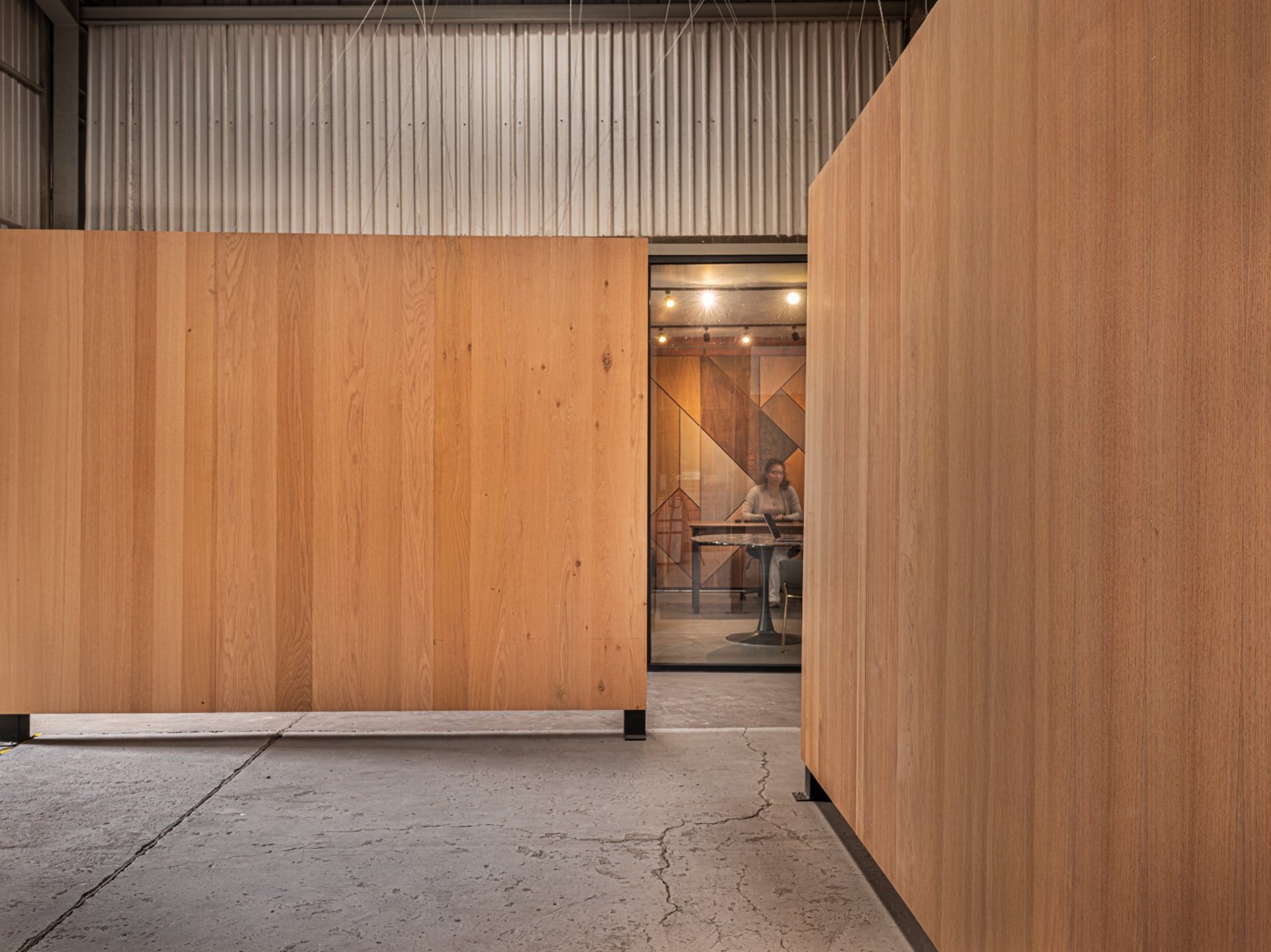 an abstract photo of a curved building with a blue sky in the background