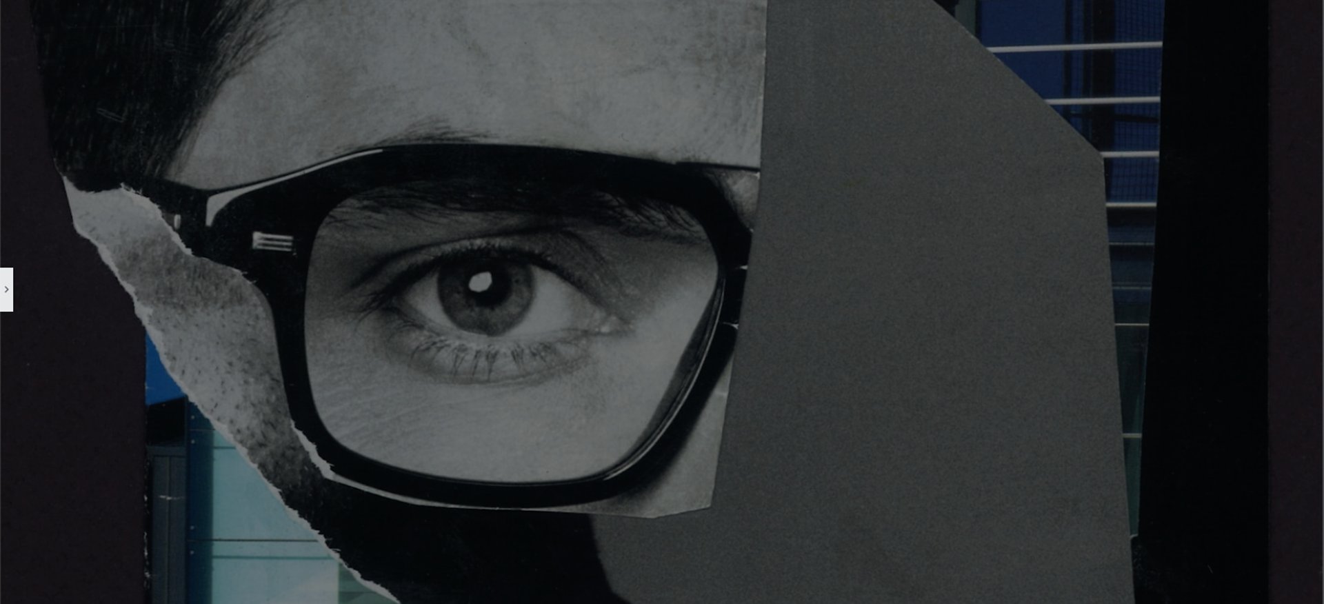 an abstract photo of a curved building with a blue sky in the background