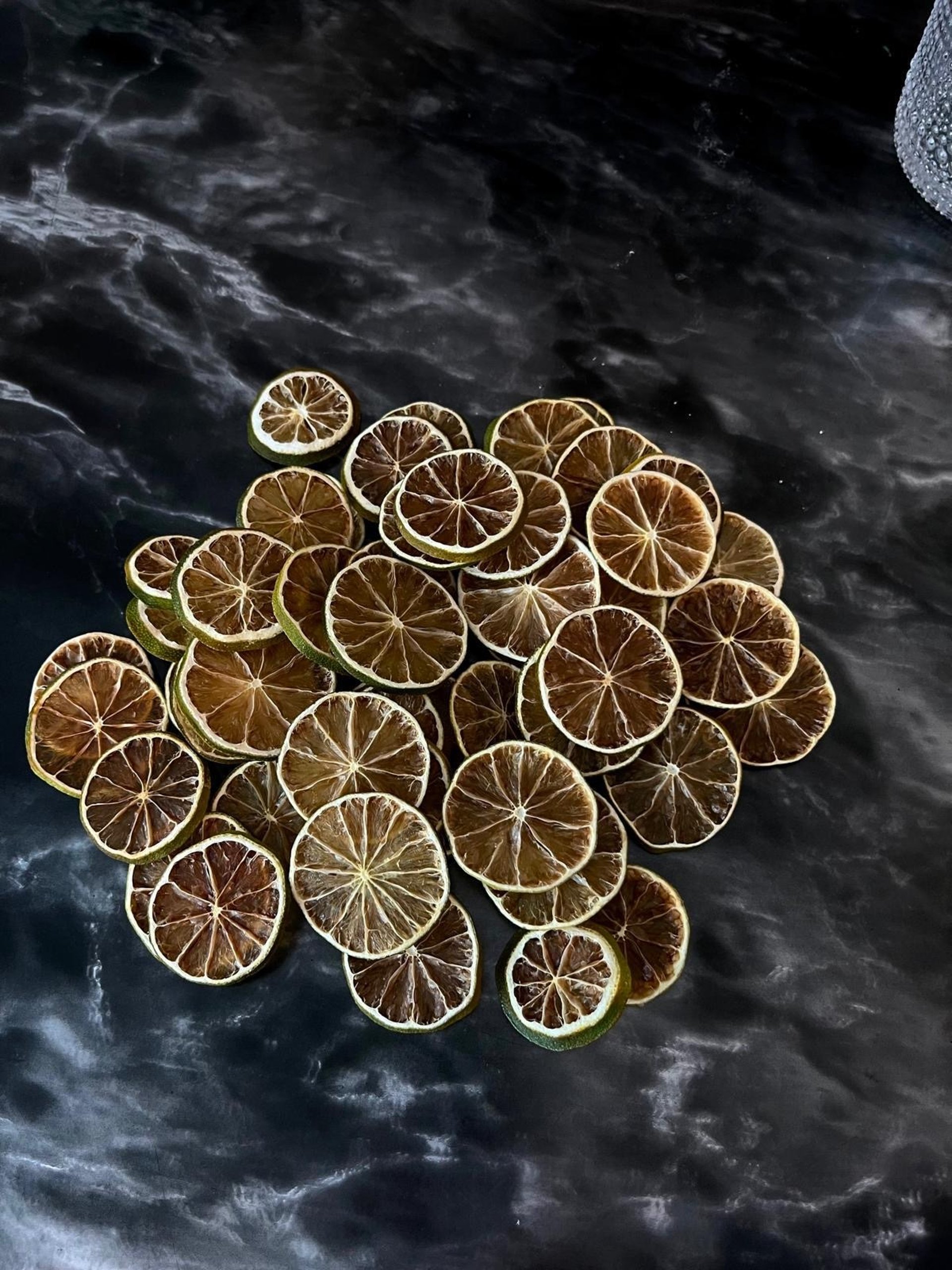 Creamy cocktail with flowers and cinnamon stick garnish