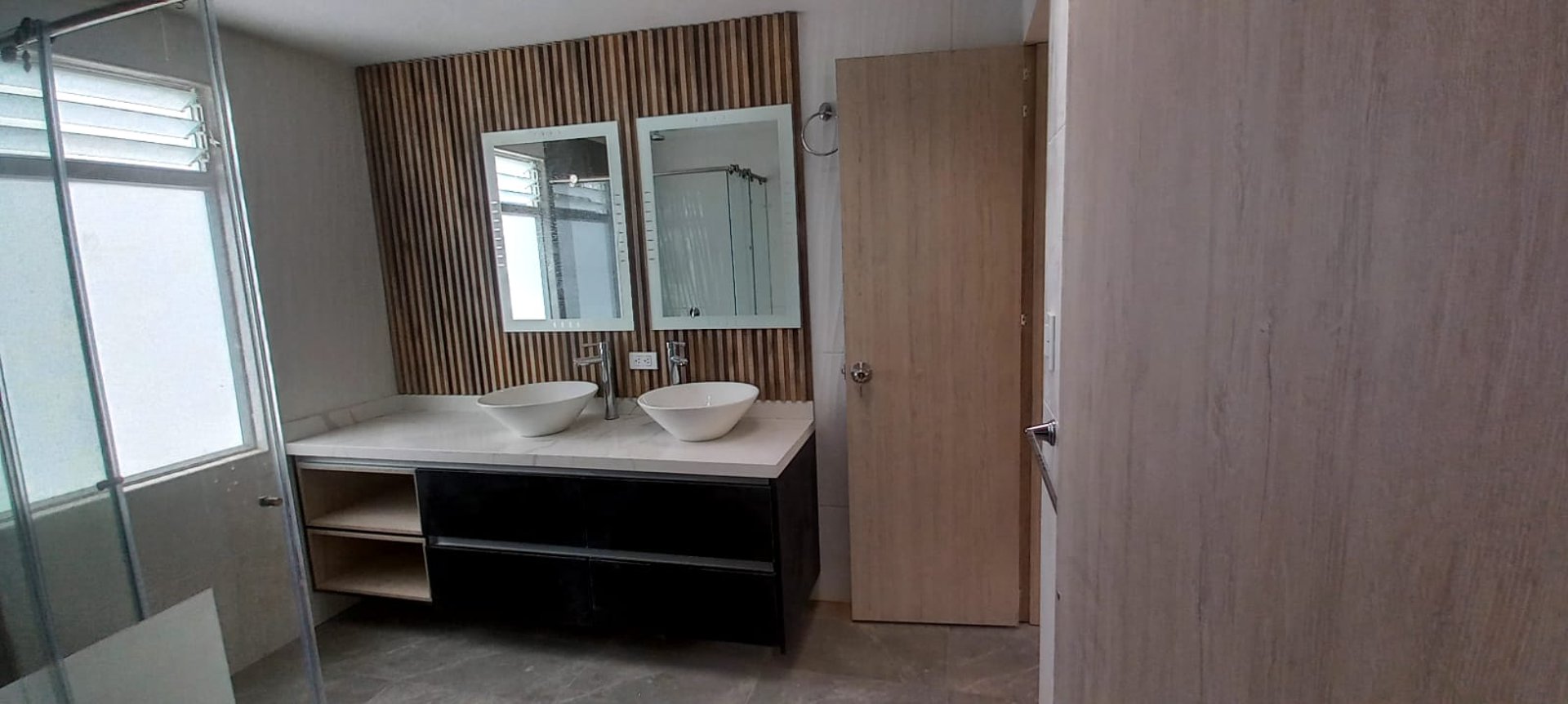 a room with a bench and a tv