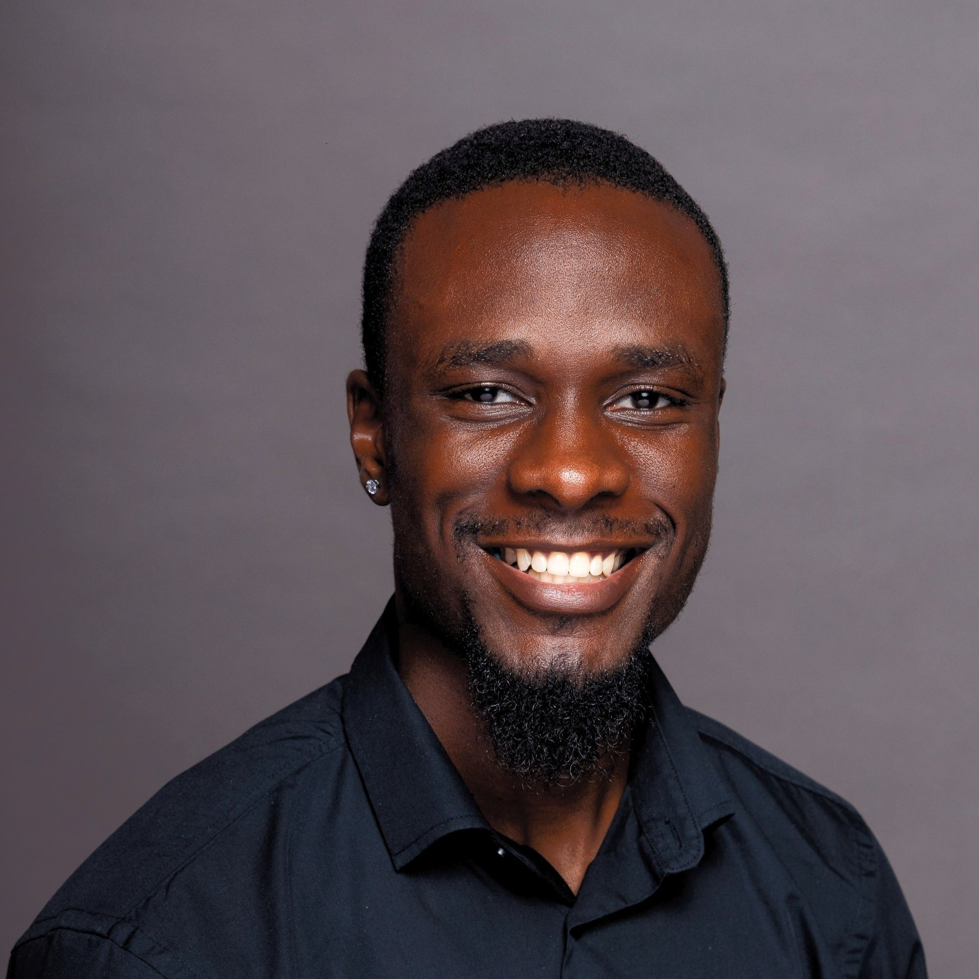 an abstract photo of a curved building with a blue sky in the background