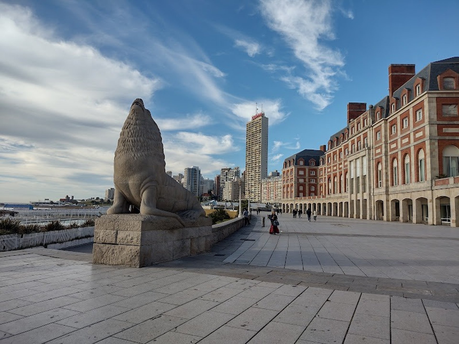 green grass field near brown mountain during daytime