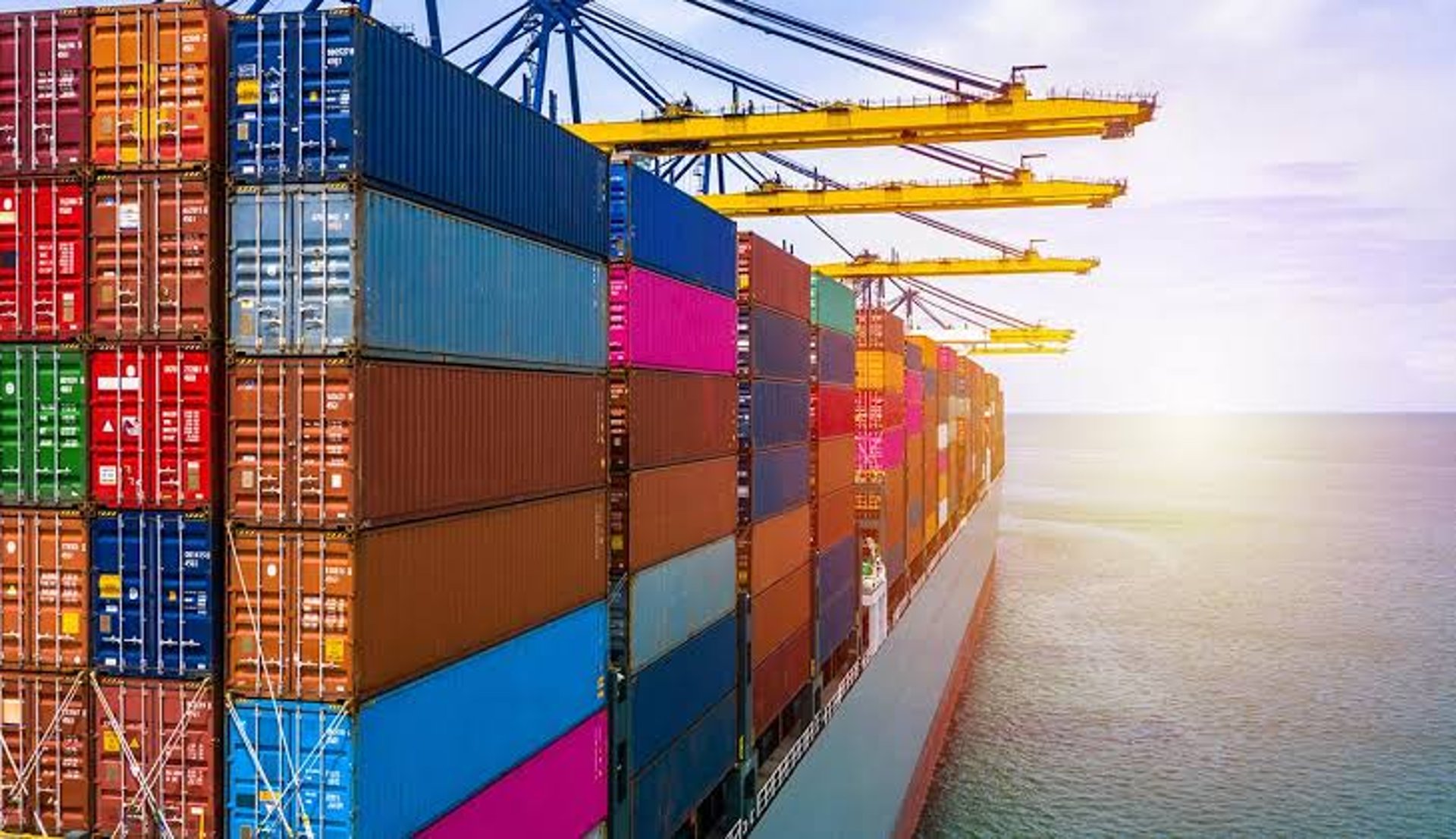 aerial view of blue and white boat on body of water during daytime