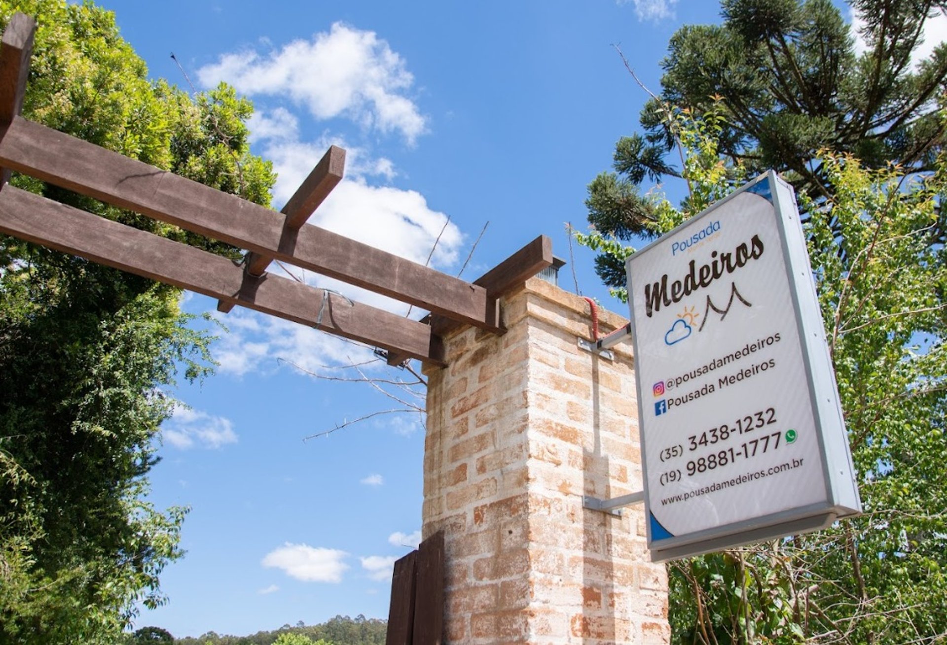 woman wearing yellow long-sleeved dress under white clouds and blue sky during daytime