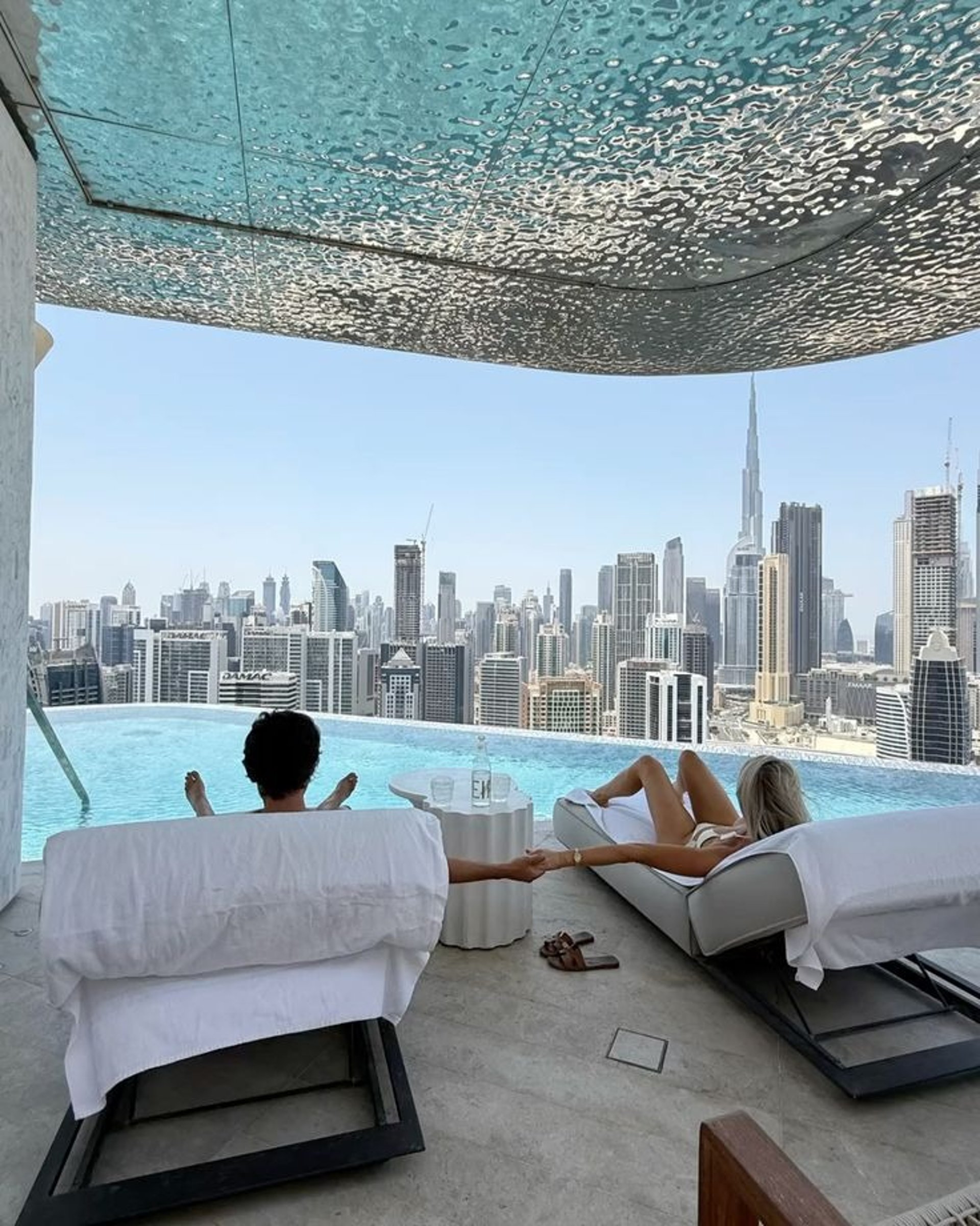 woman wearing yellow long-sleeved dress under white clouds and blue sky during daytime