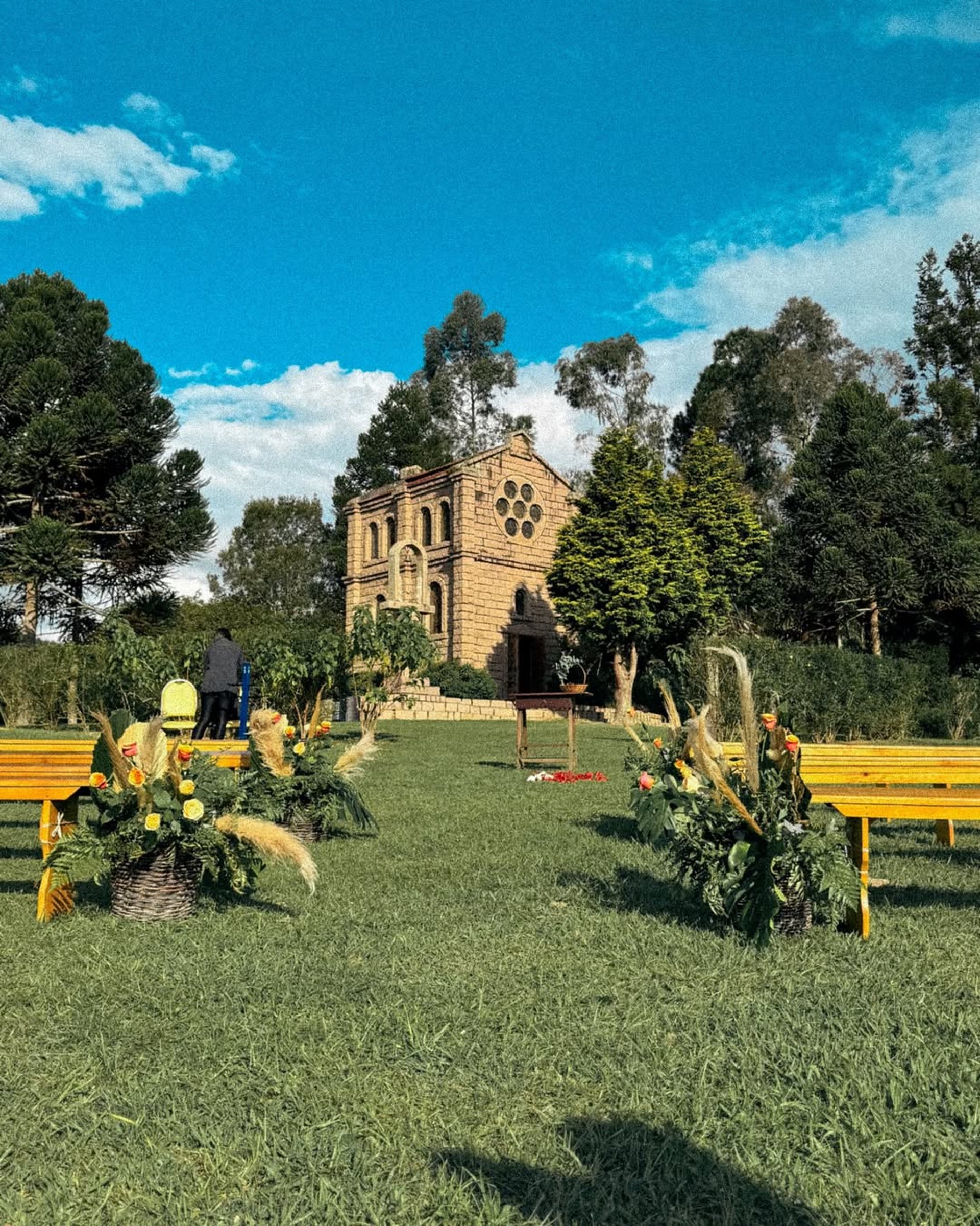 an abstract photo of a curved building with a blue sky in the background