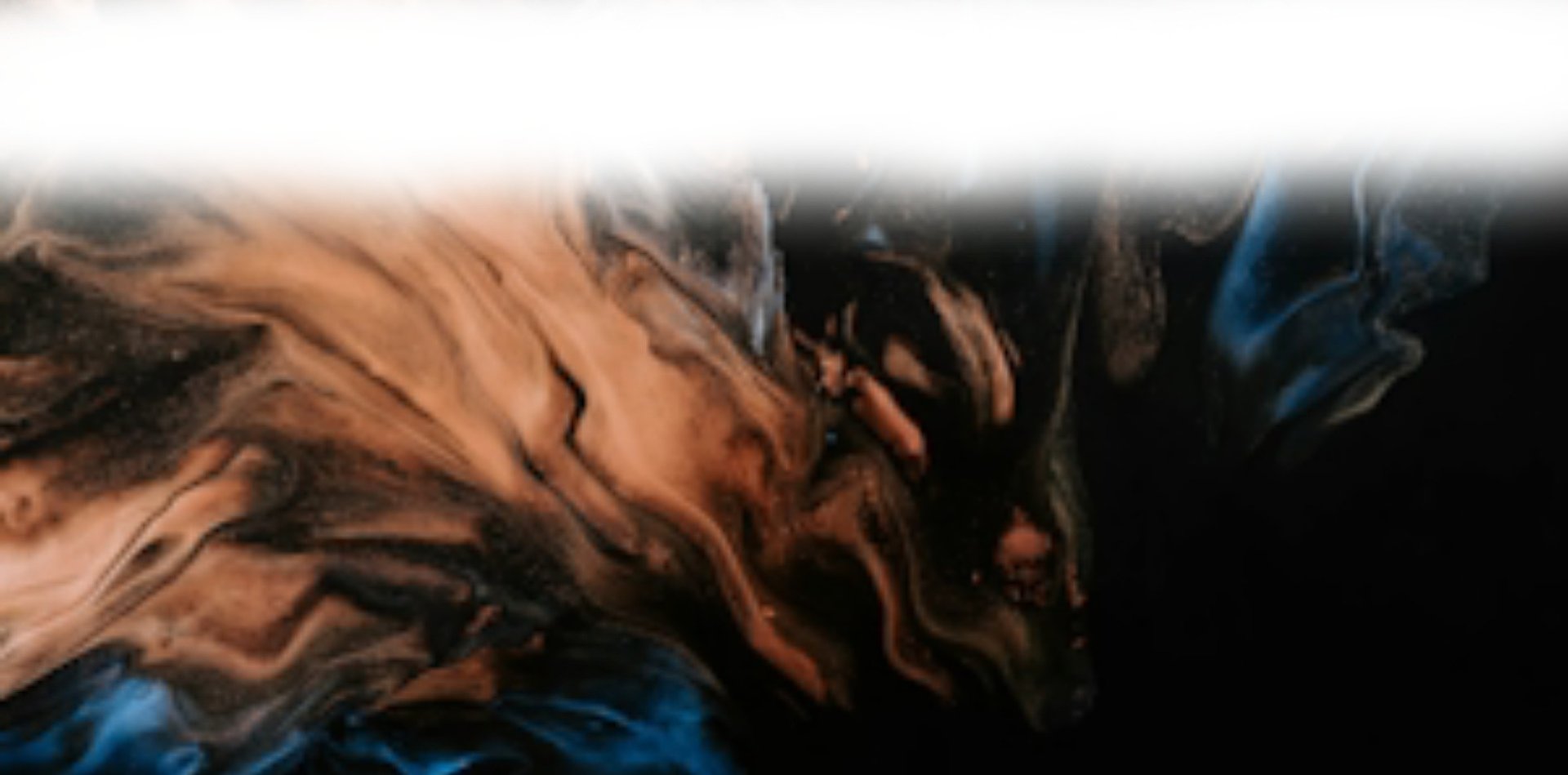 a close up of a black and brown abstract painting