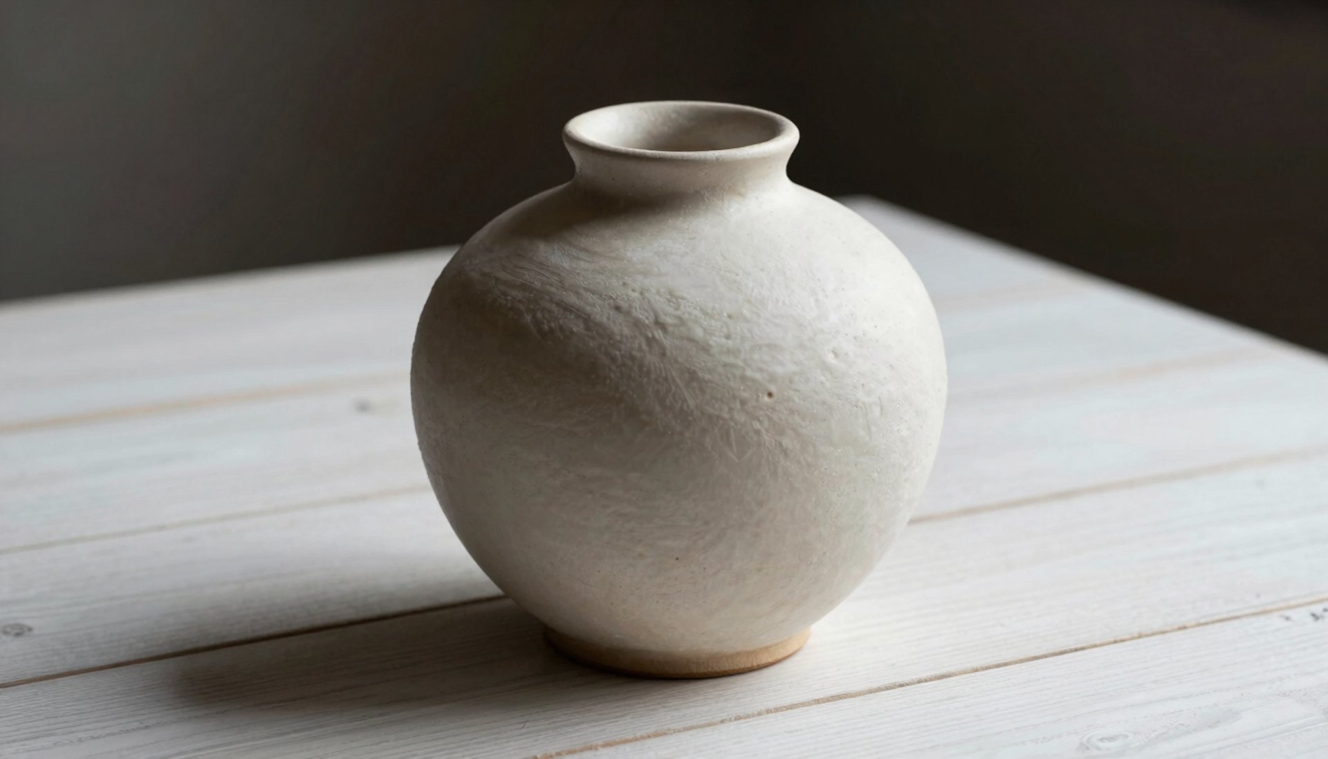 white and brown ceramic vase