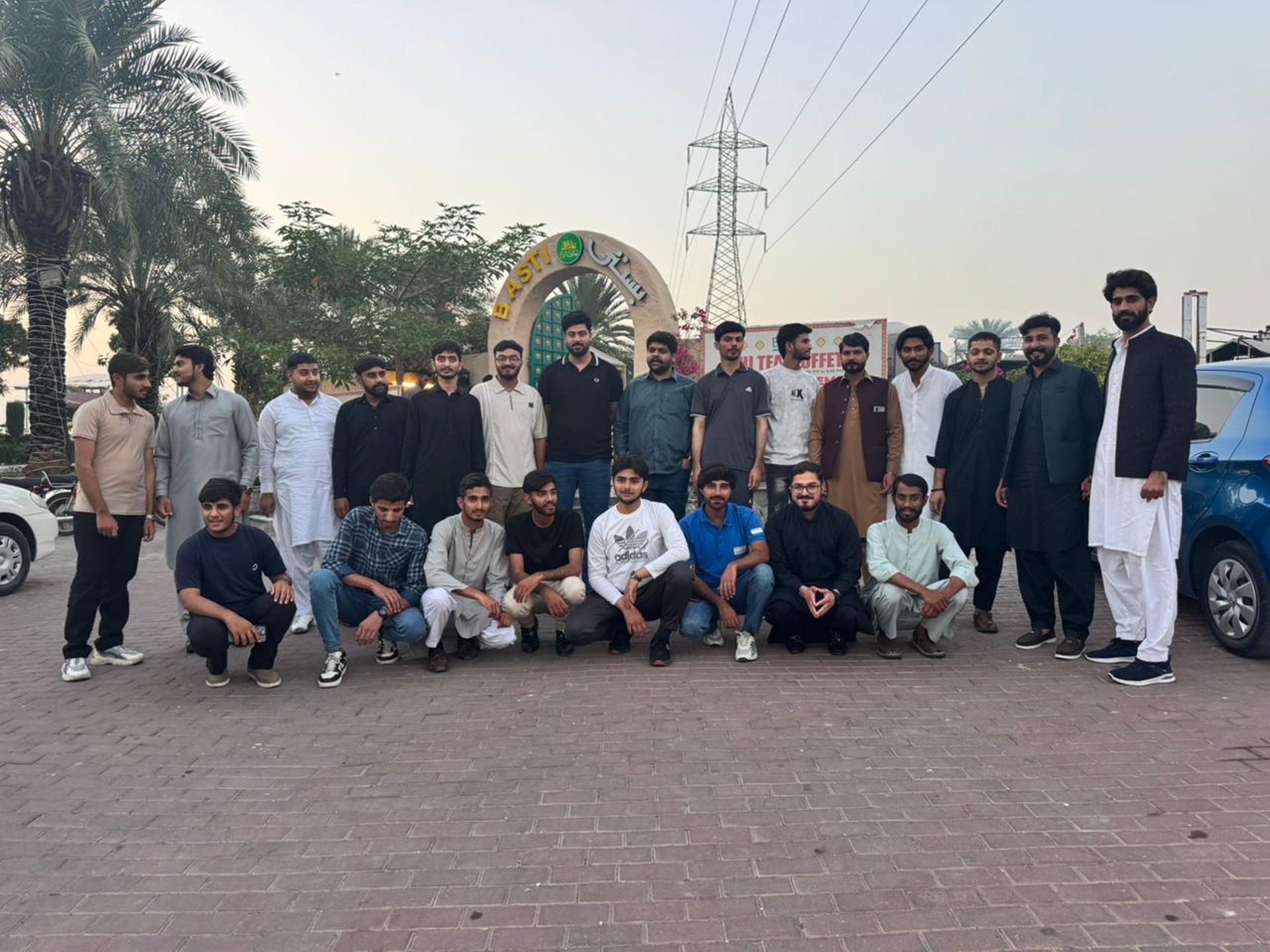 woman wearing yellow long-sleeved dress under white clouds and blue sky during daytime