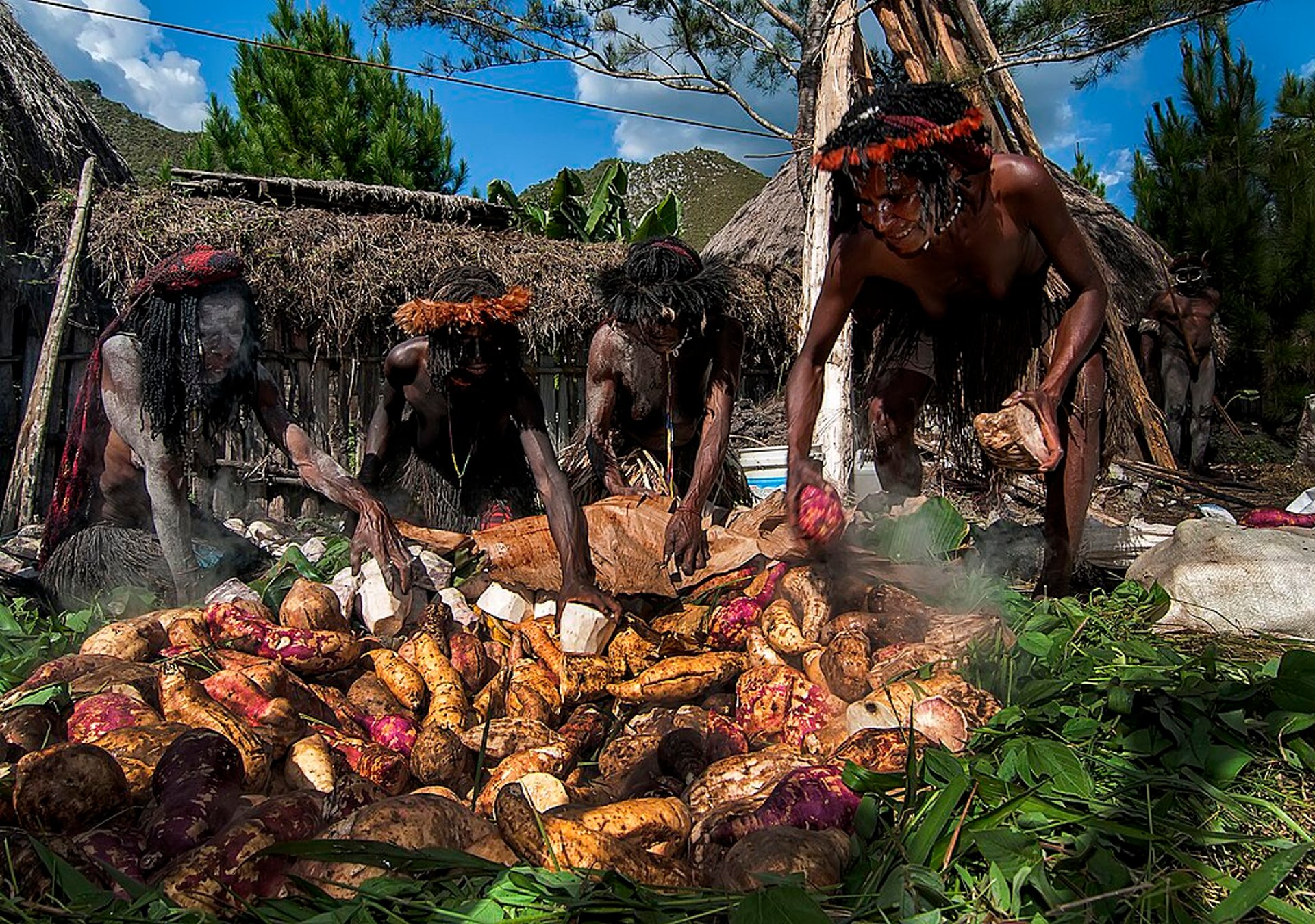 cooking method uses a pit in the ground combined with heated stones