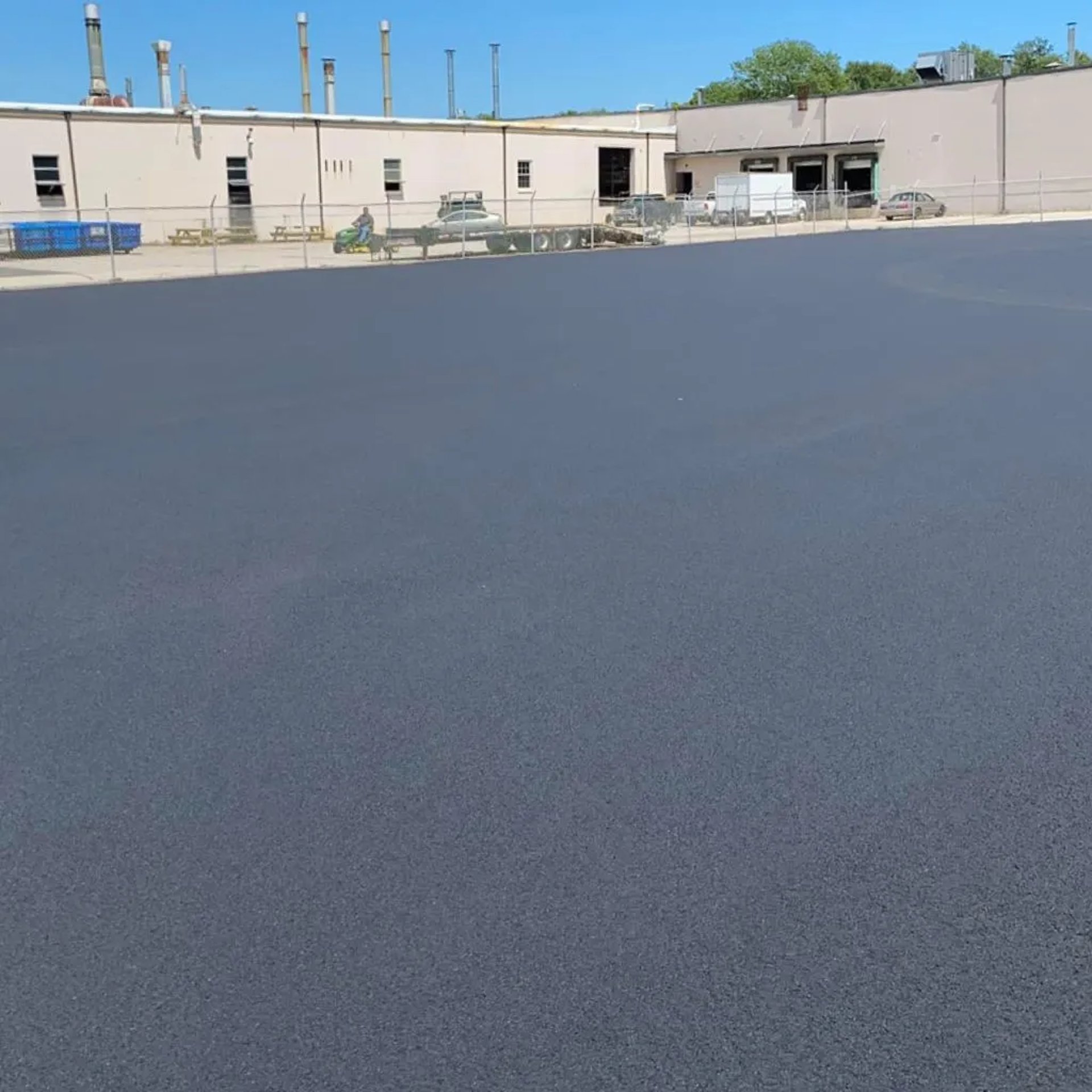 an abstract photo of a curved building with a blue sky in the background