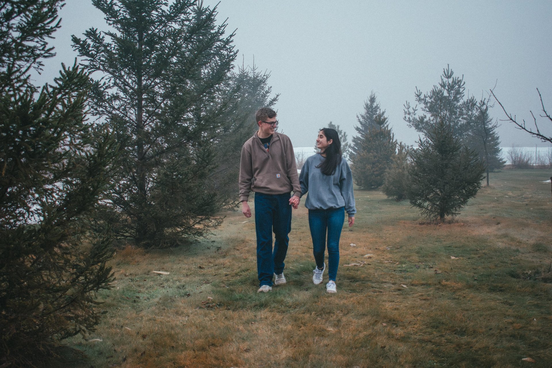 couple wearing silver-colored rings