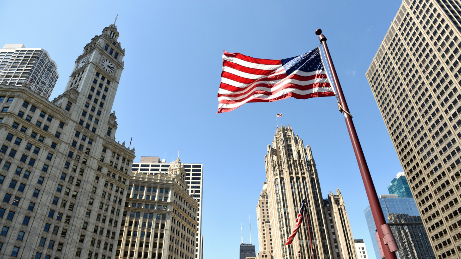 an abstract photo of a curved building with a blue sky in the background