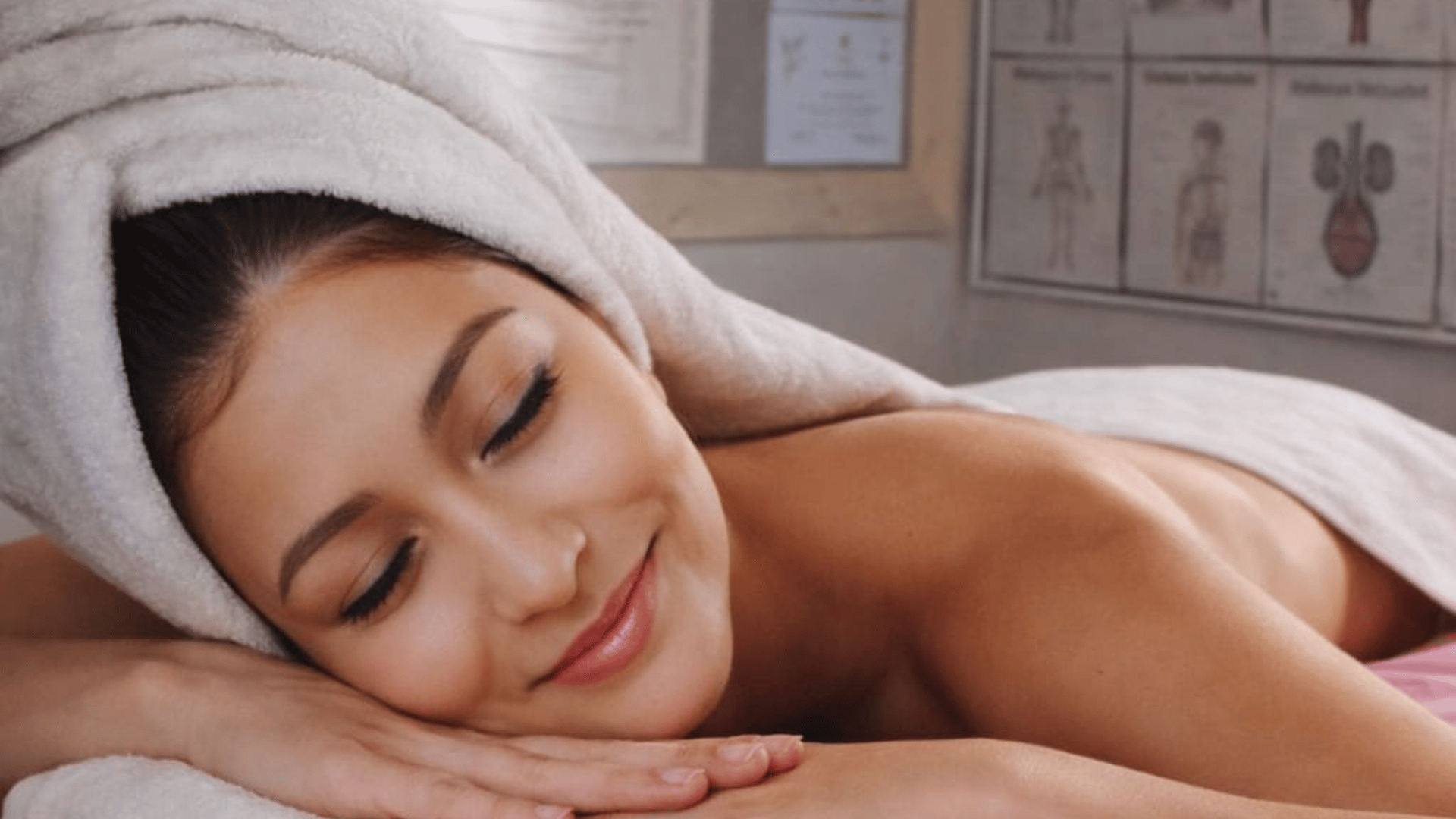 topless woman lying on bed
