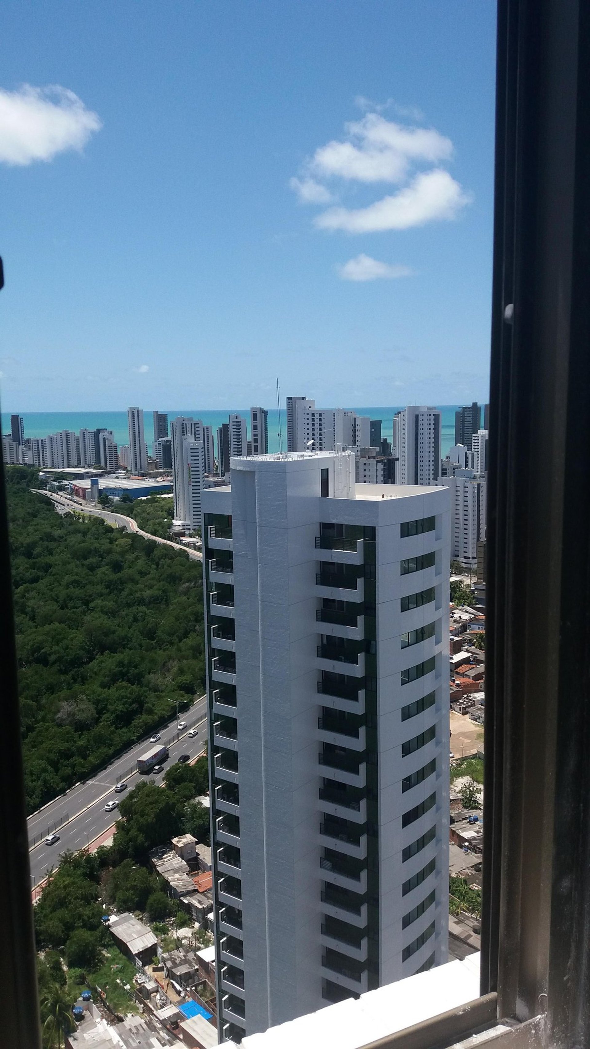 woman wearing yellow long-sleeved dress under white clouds and blue sky during daytime