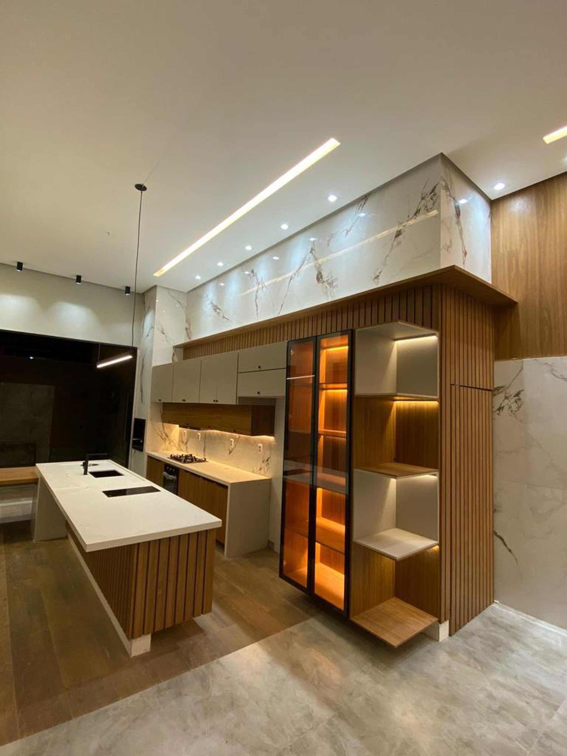 an abstract photo of a curved building with a blue sky in the background