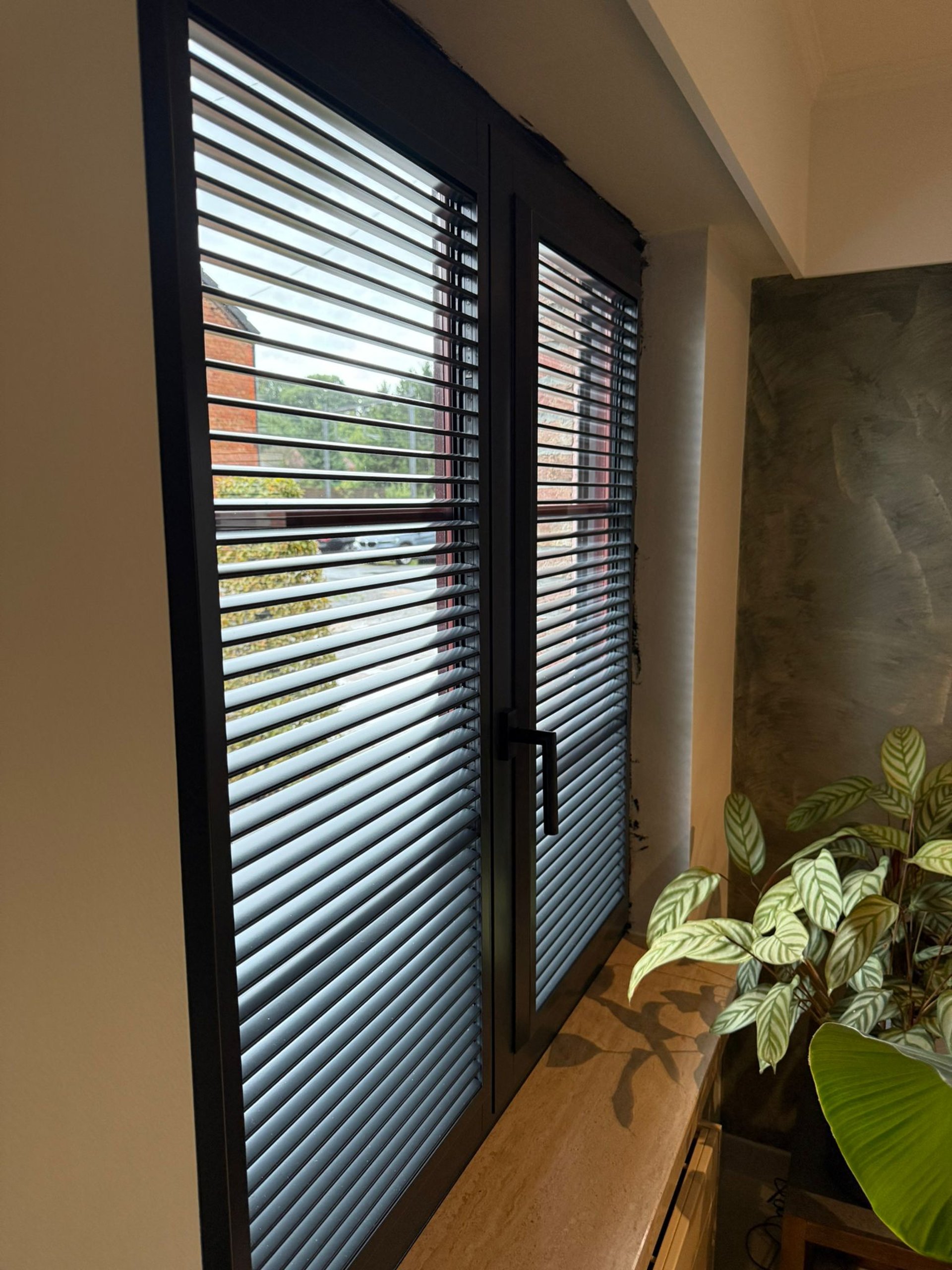 black and brown leather padded tub sofa