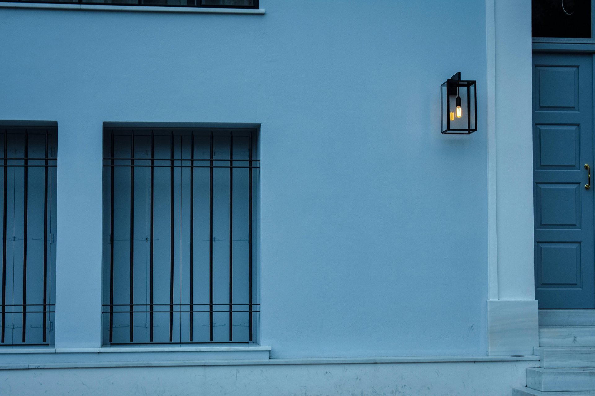 brown brick building with white and black street light