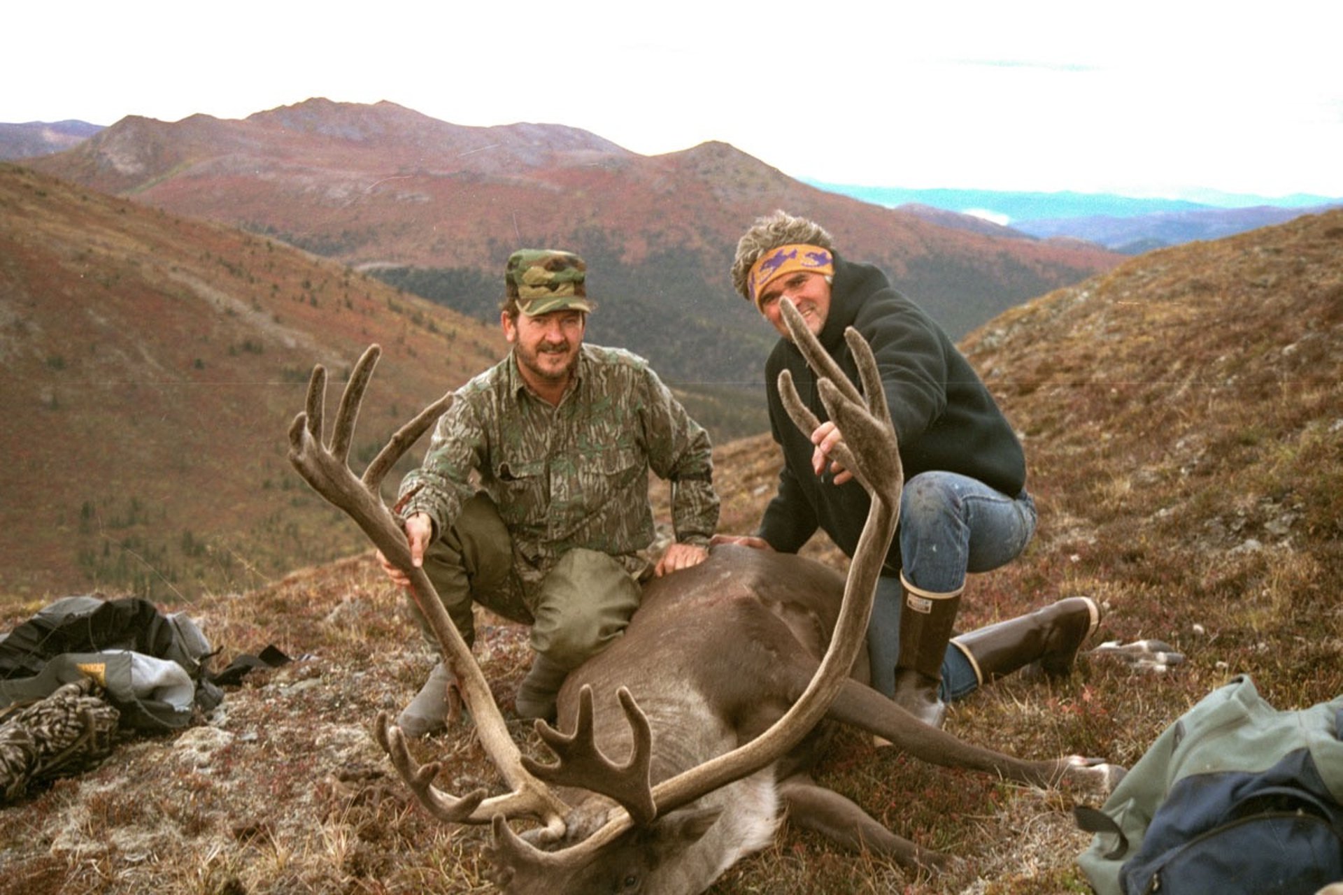Master Guide Art Andreis with a client and a successful caribou harvest in Alaska.