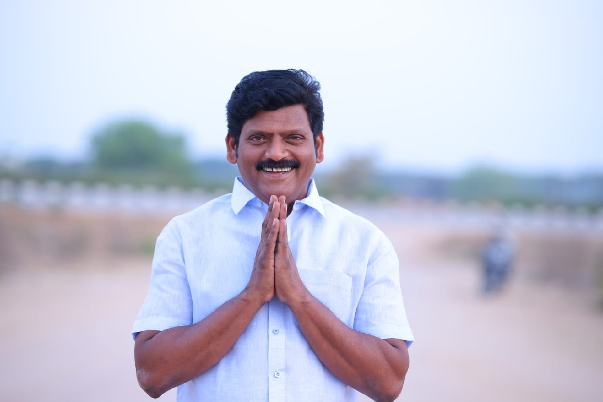 person wearing grey knit sweater