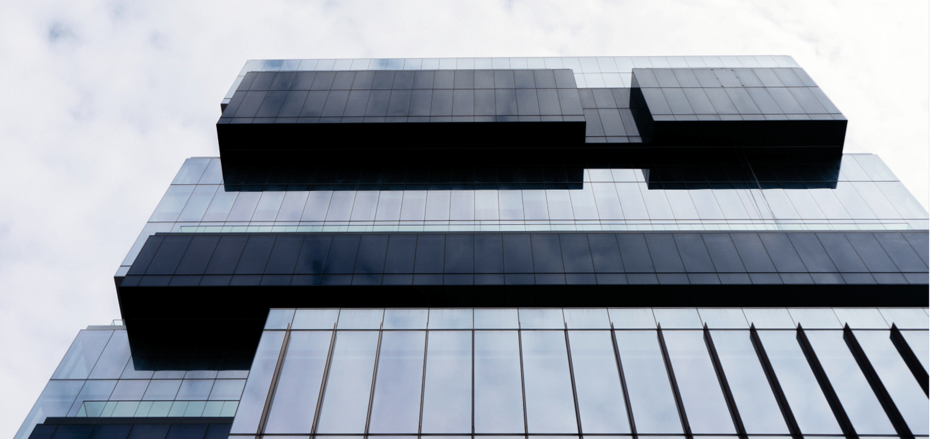 low angle photography of cranes on top of building