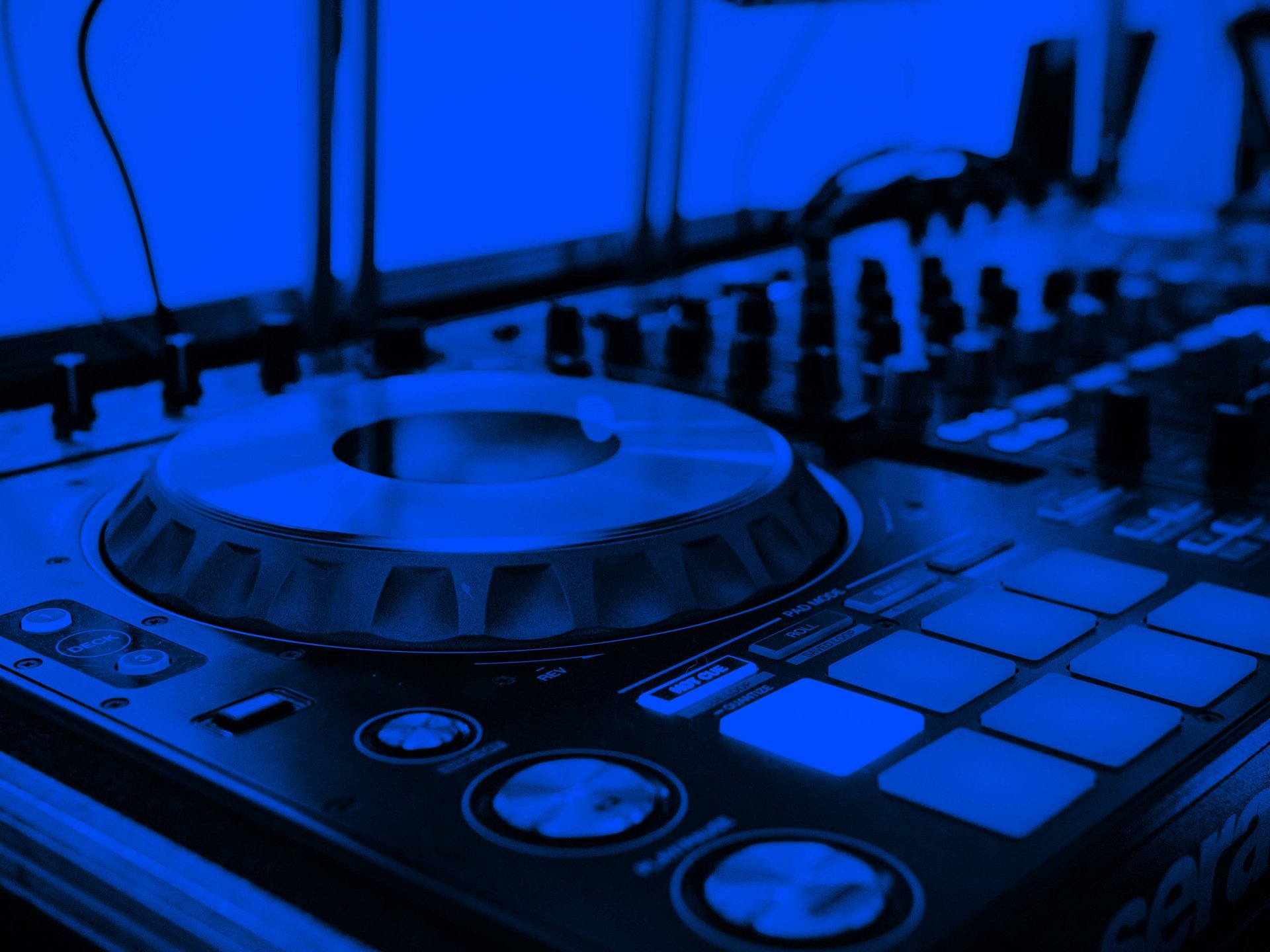 a close up of a computer keyboard with neon lights