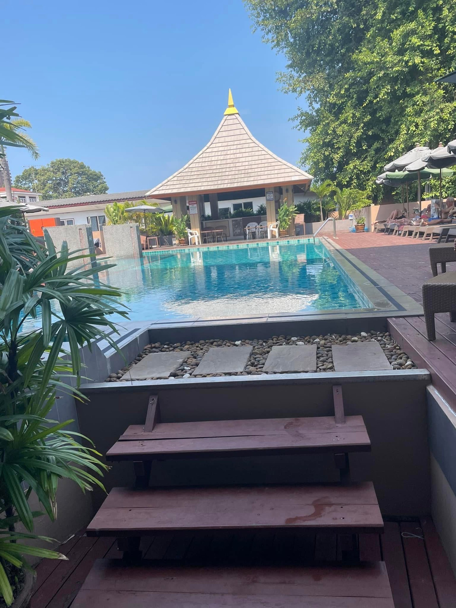 woman wearing yellow long-sleeved dress under white clouds and blue sky during daytime