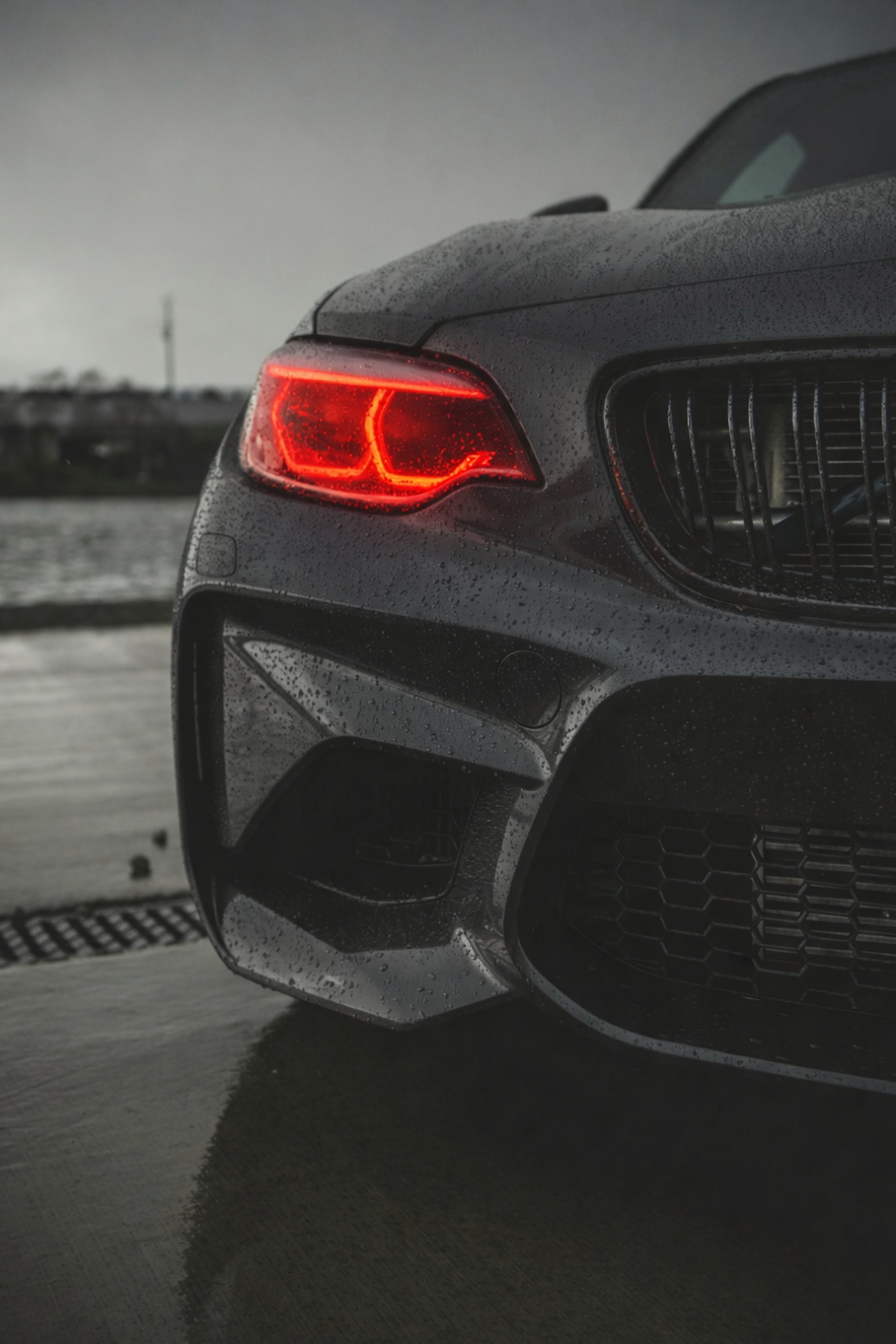 grayscale photo of headlight vehicle