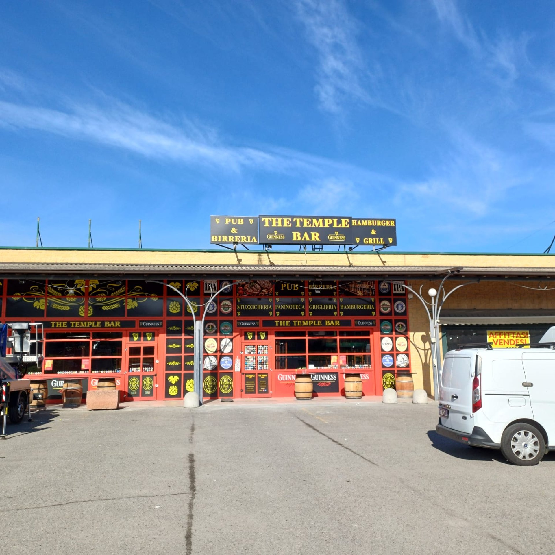 black and yellow bmw m 3 coupe parked near blue wall