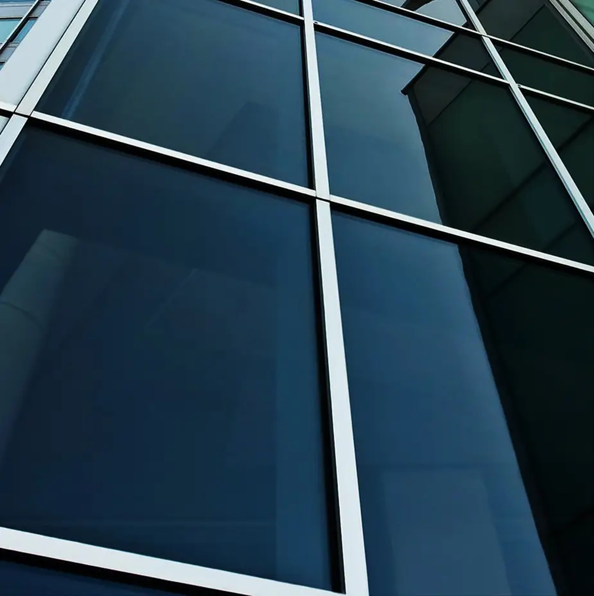 black and yellow bmw m 3 coupe parked near blue wall