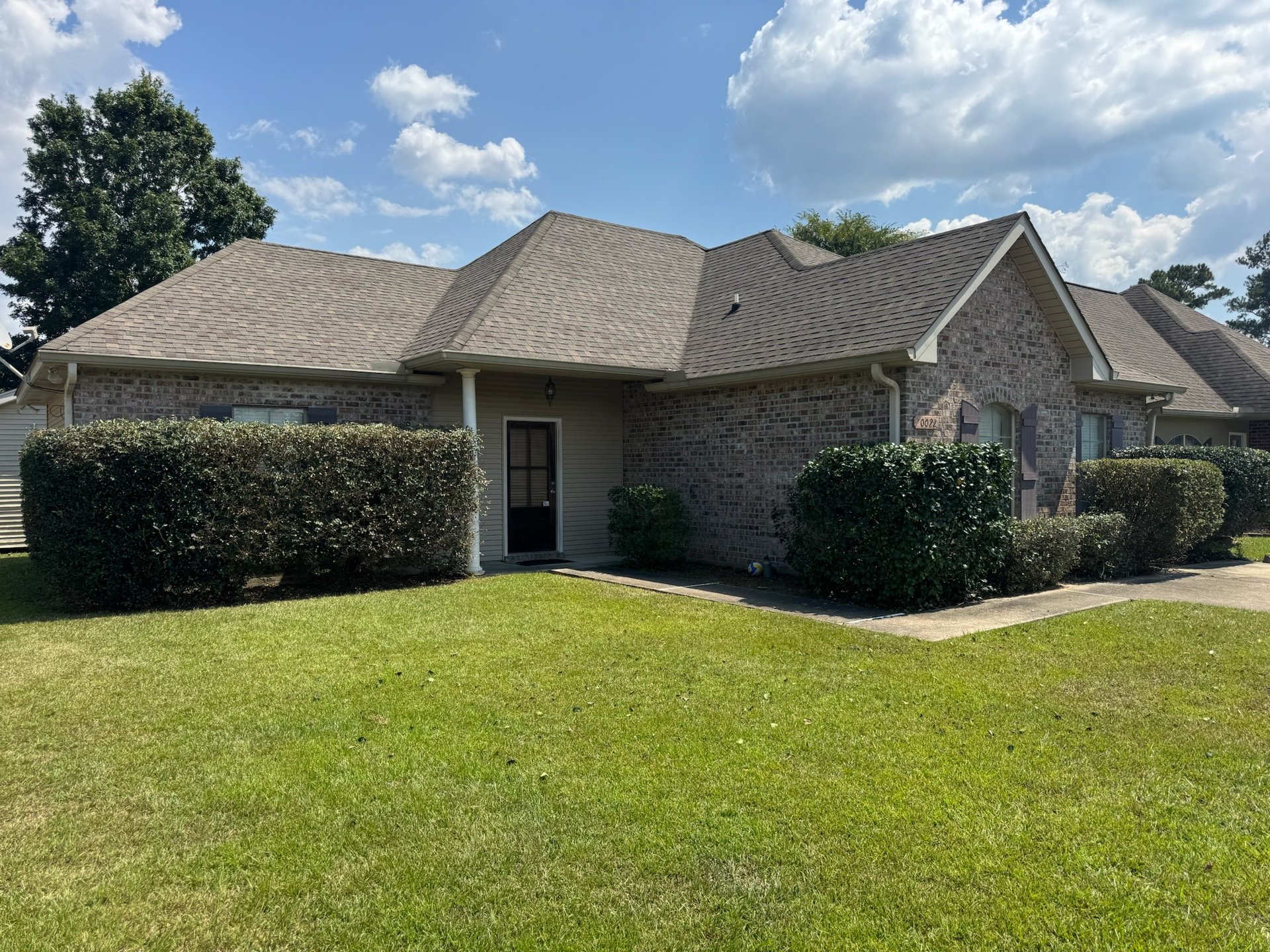 an abstract photo of a curved building with a blue sky in the background