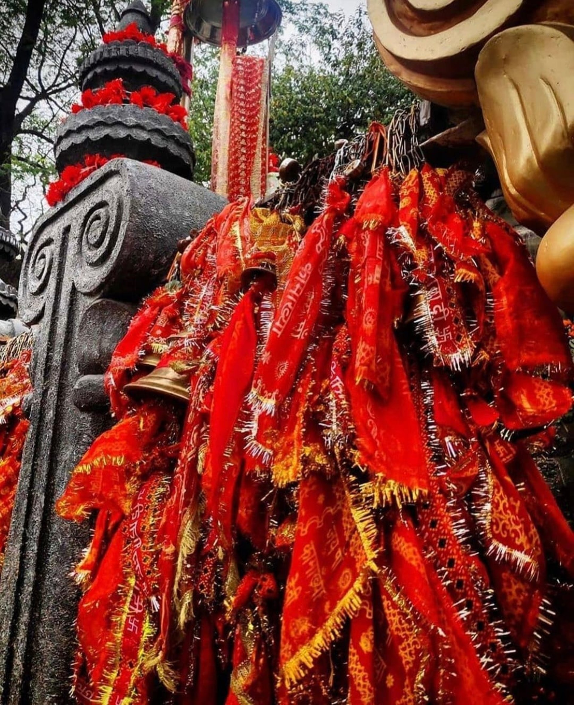 people standing in gold and white floral ceiling