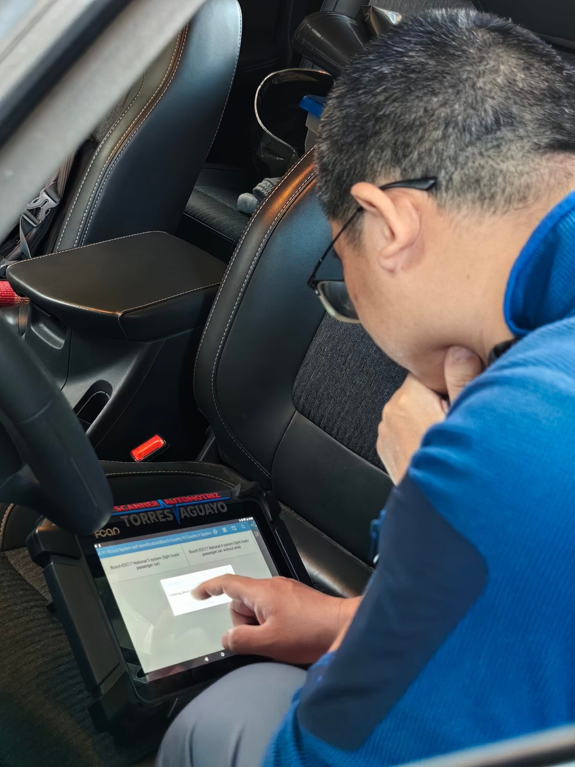 man in black jacket and blue denim jeans riding motorcycle