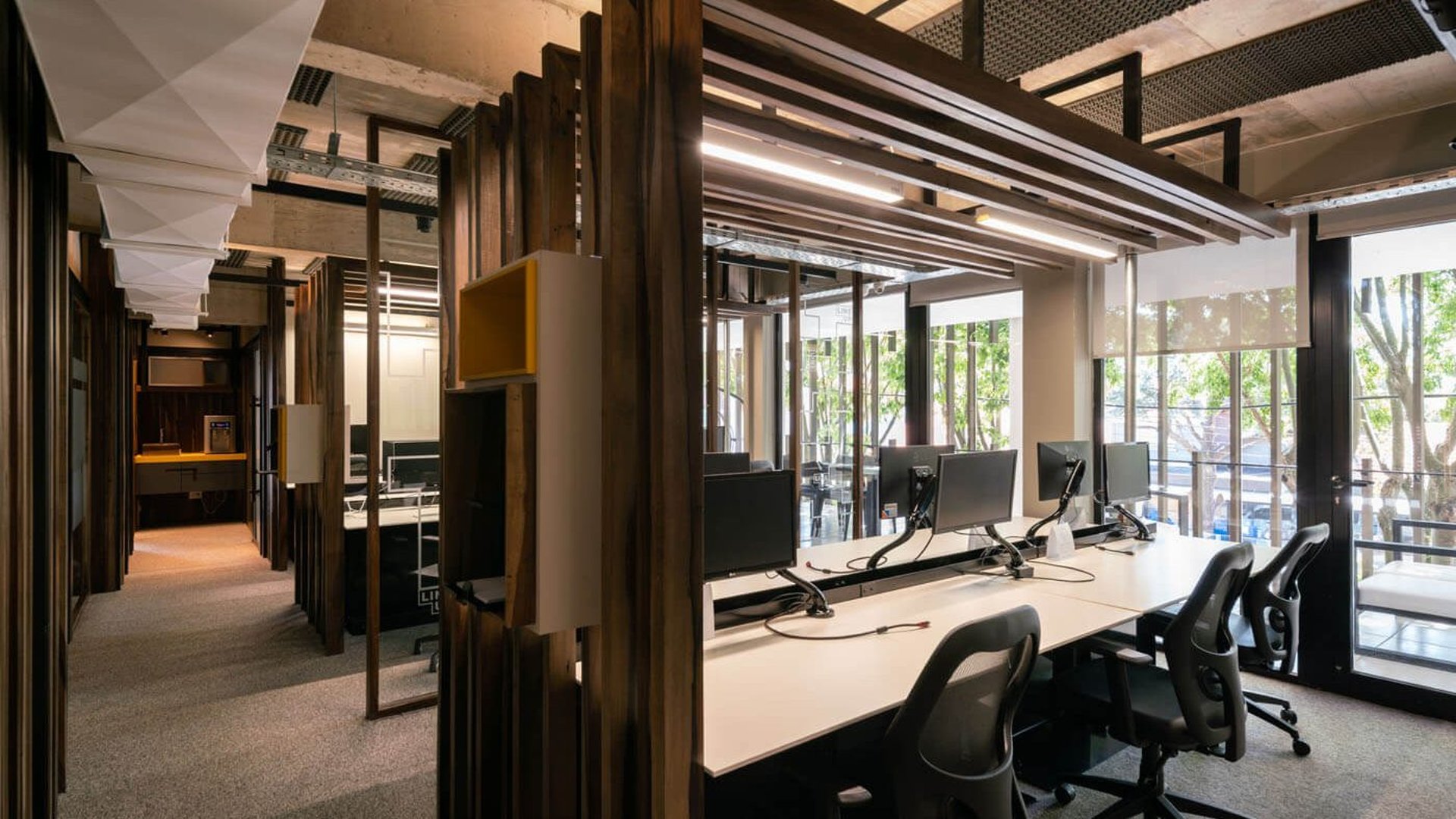 an abstract photo of a curved building with a blue sky in the background