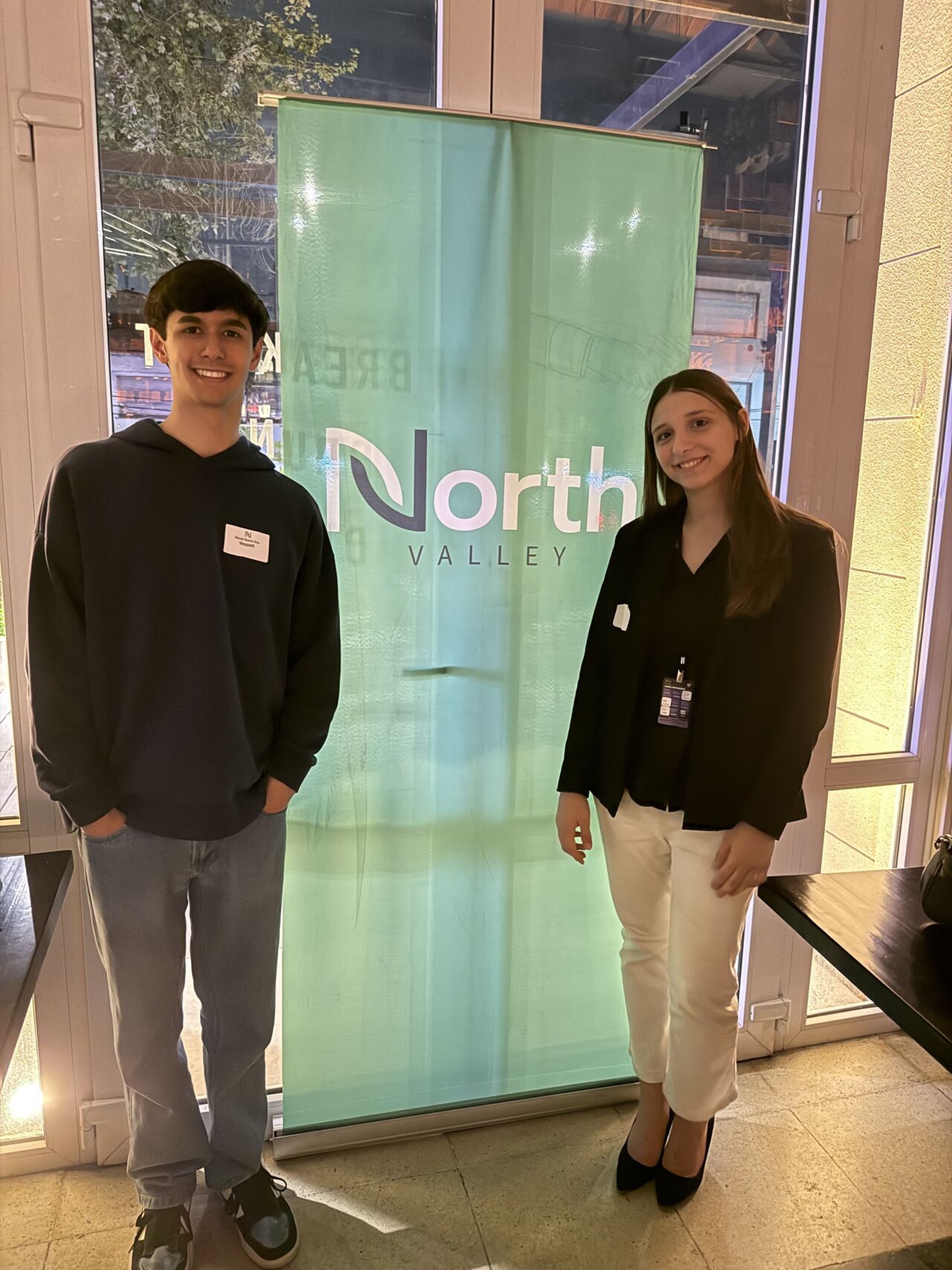 an abstract photo of a curved building with a blue sky in the background