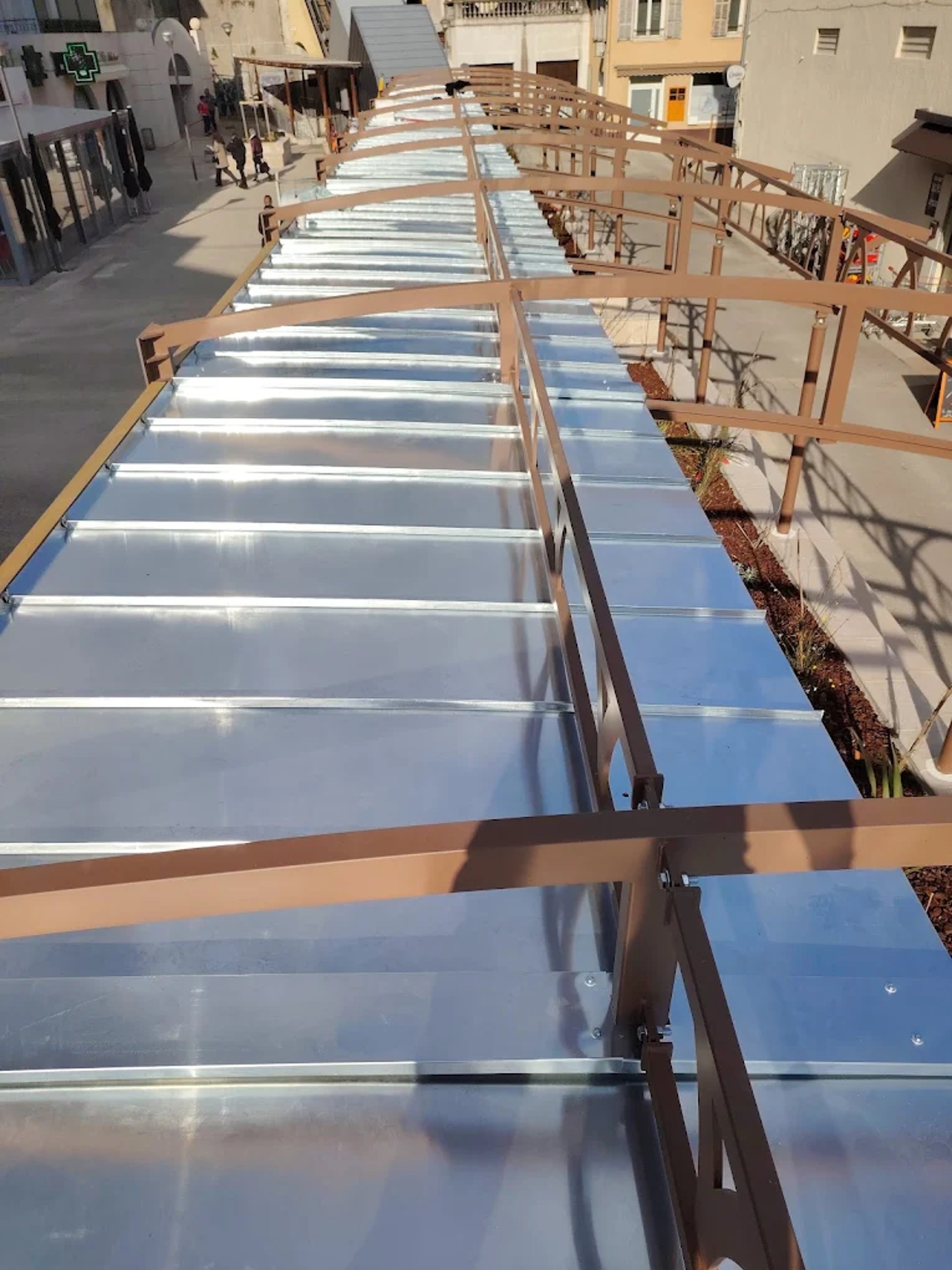 Roof under construction, with tiles being laid.