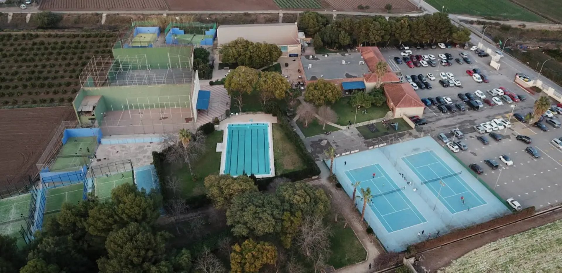 an abstract photo of a curved building with a blue sky in the background