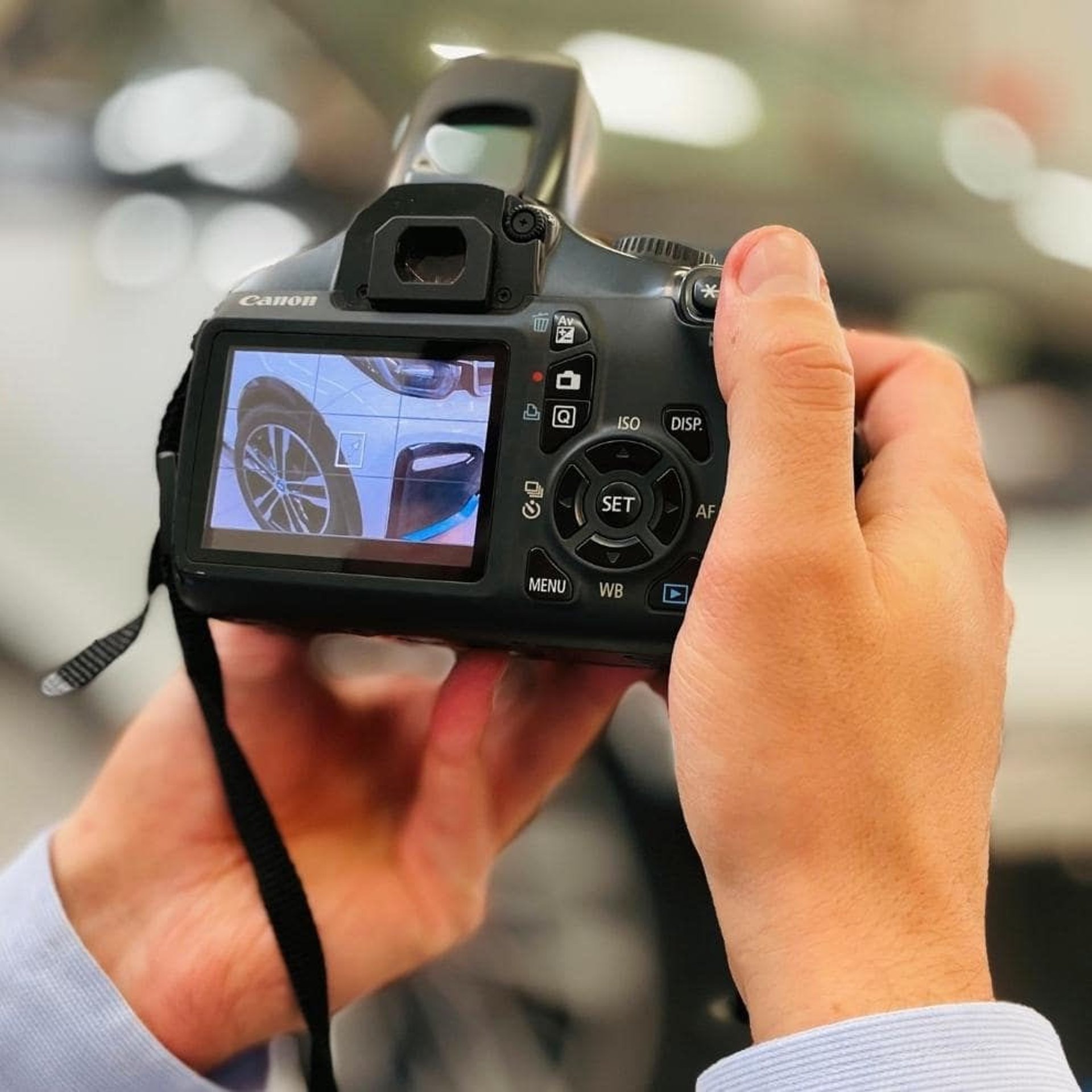 black nikon dslr camera on white printer paper